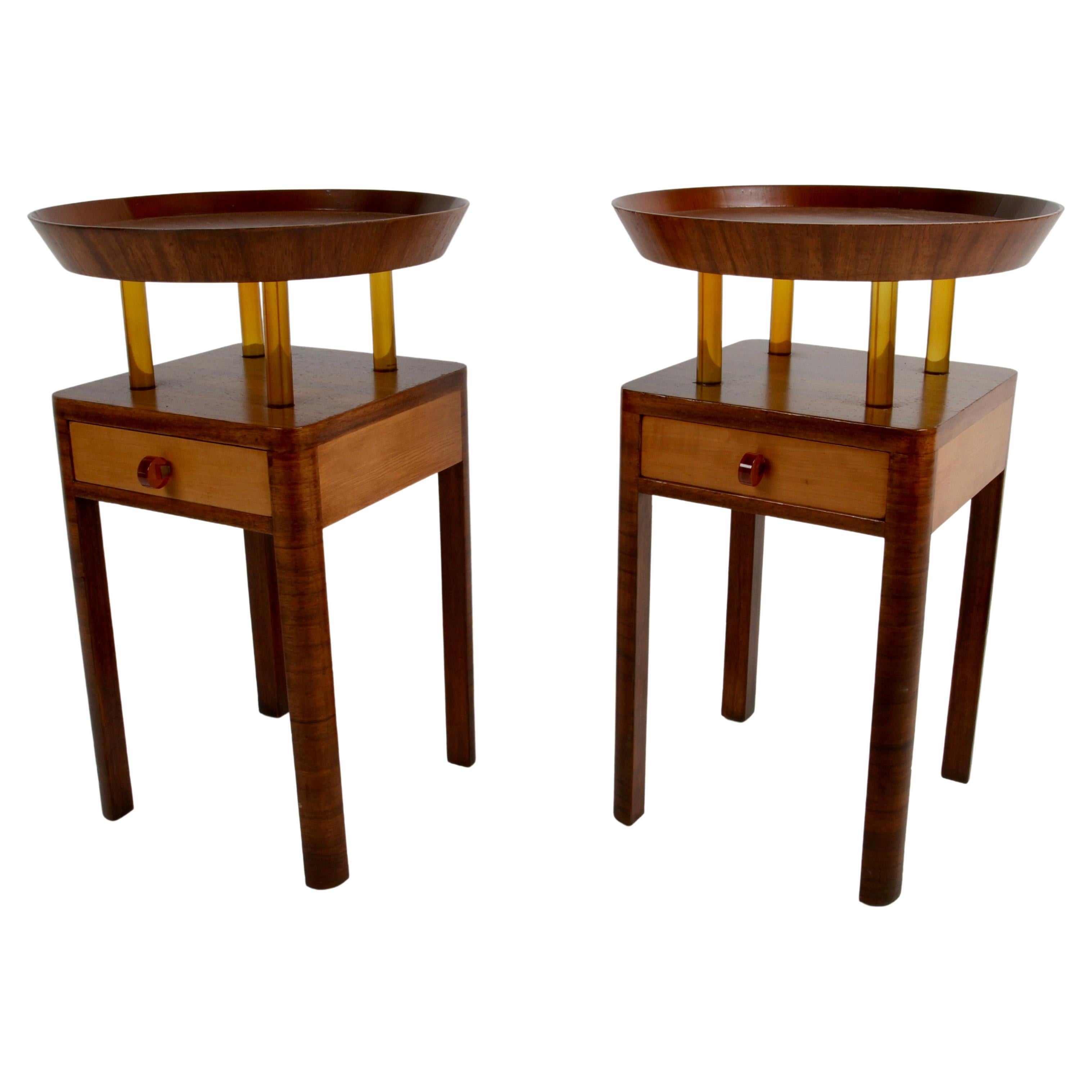 Rare pair of elegant Grosfeld House two-tone Mahogany & Elm end tables or nightstands with Bakelite details first showed up in the 1938 Grosfeld House 