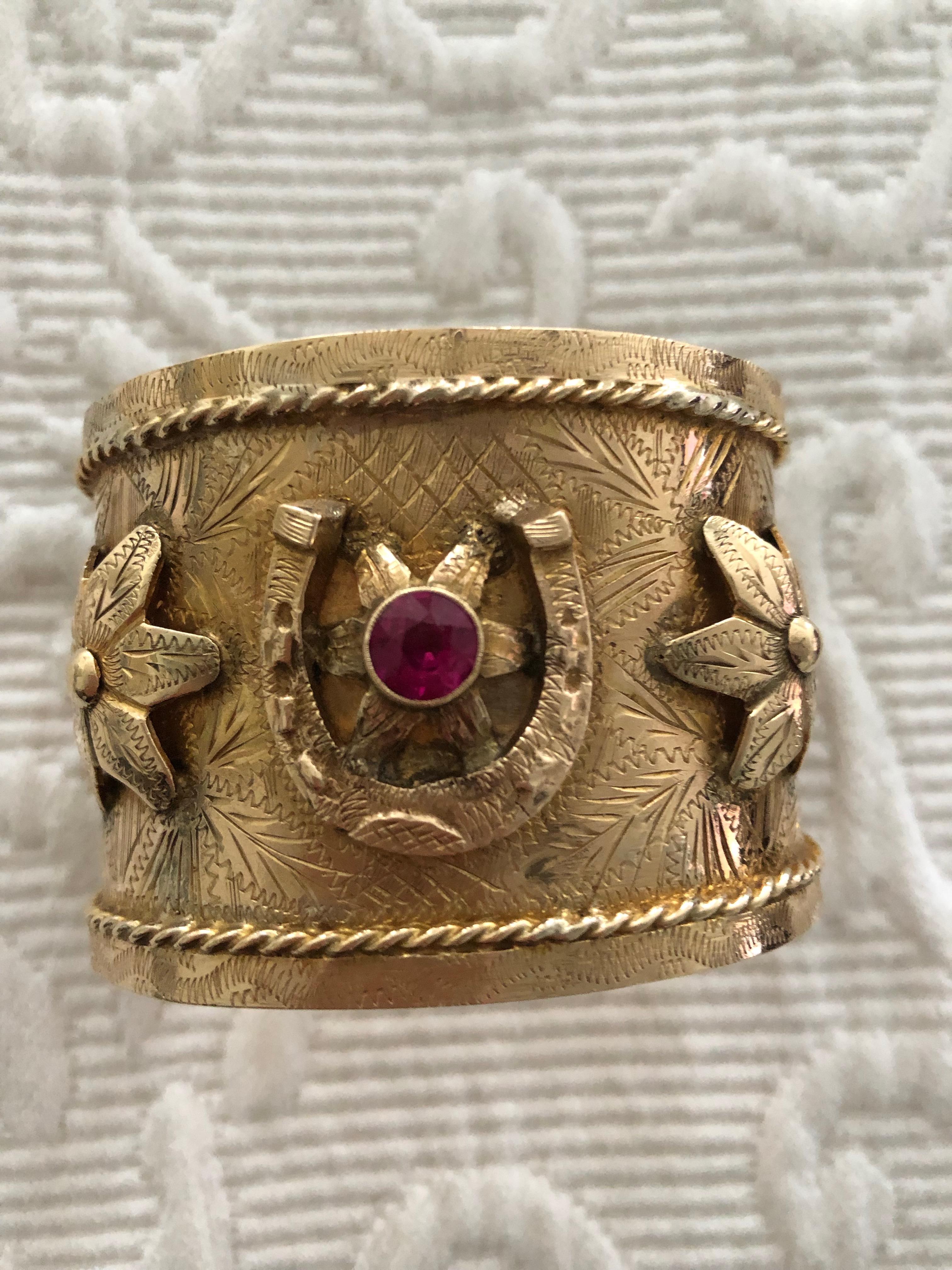 One cuff is rare but a pair is very rare! This pair of gypsy cuff bracelets are in 14 karat gold (I have only seen 14 karat gold) having 5 rosette design, a red rubies  to the centre of each bracelet. These are very rare. During the early 1900s