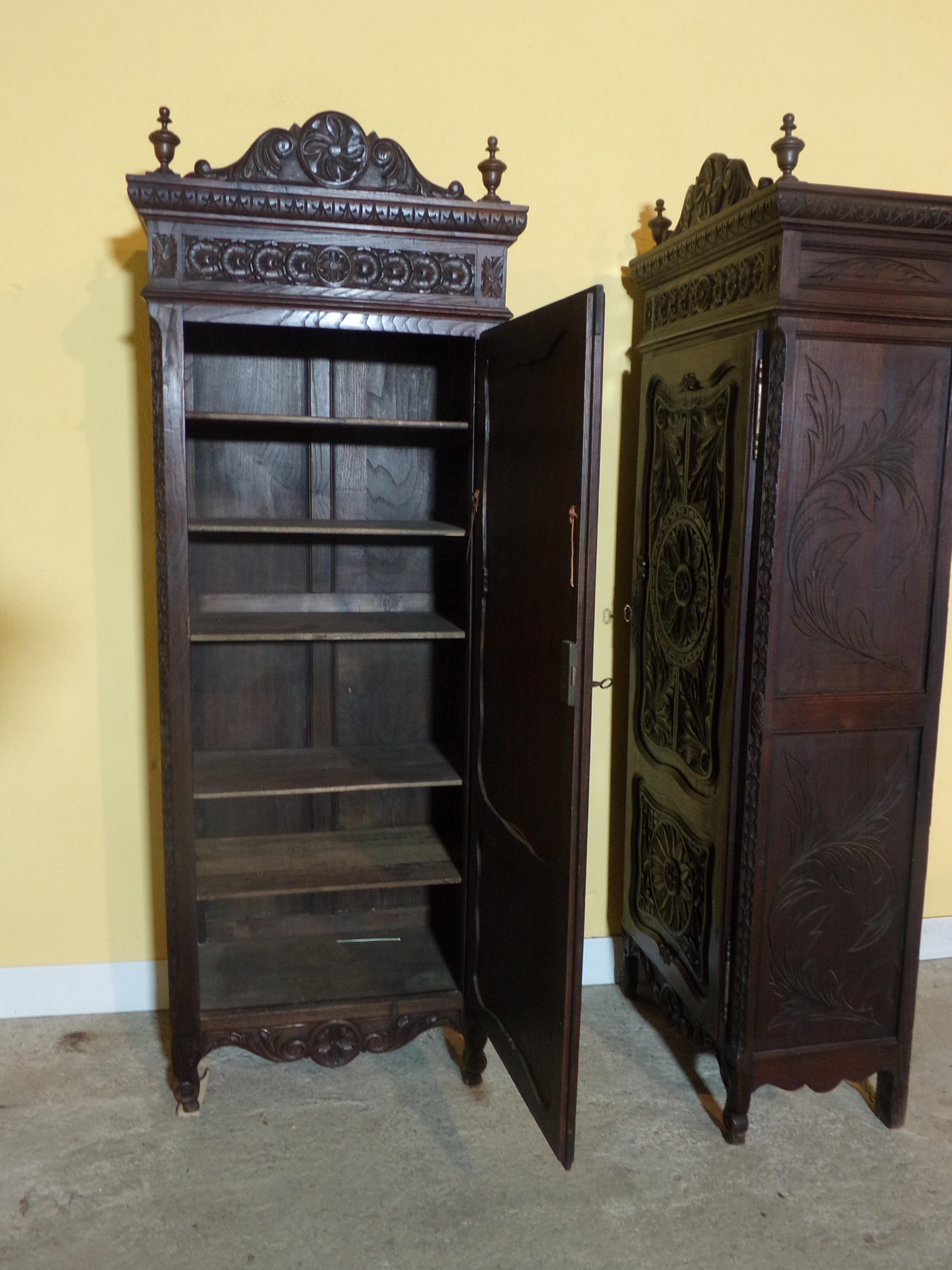 An extremely rare pair of hand carved oak armoires / Bonnetieres of small proportions Ideally suited for modern living and which would form a focal point in almost any room of the house. Bonnetieres were originally used in entrances and hall ways