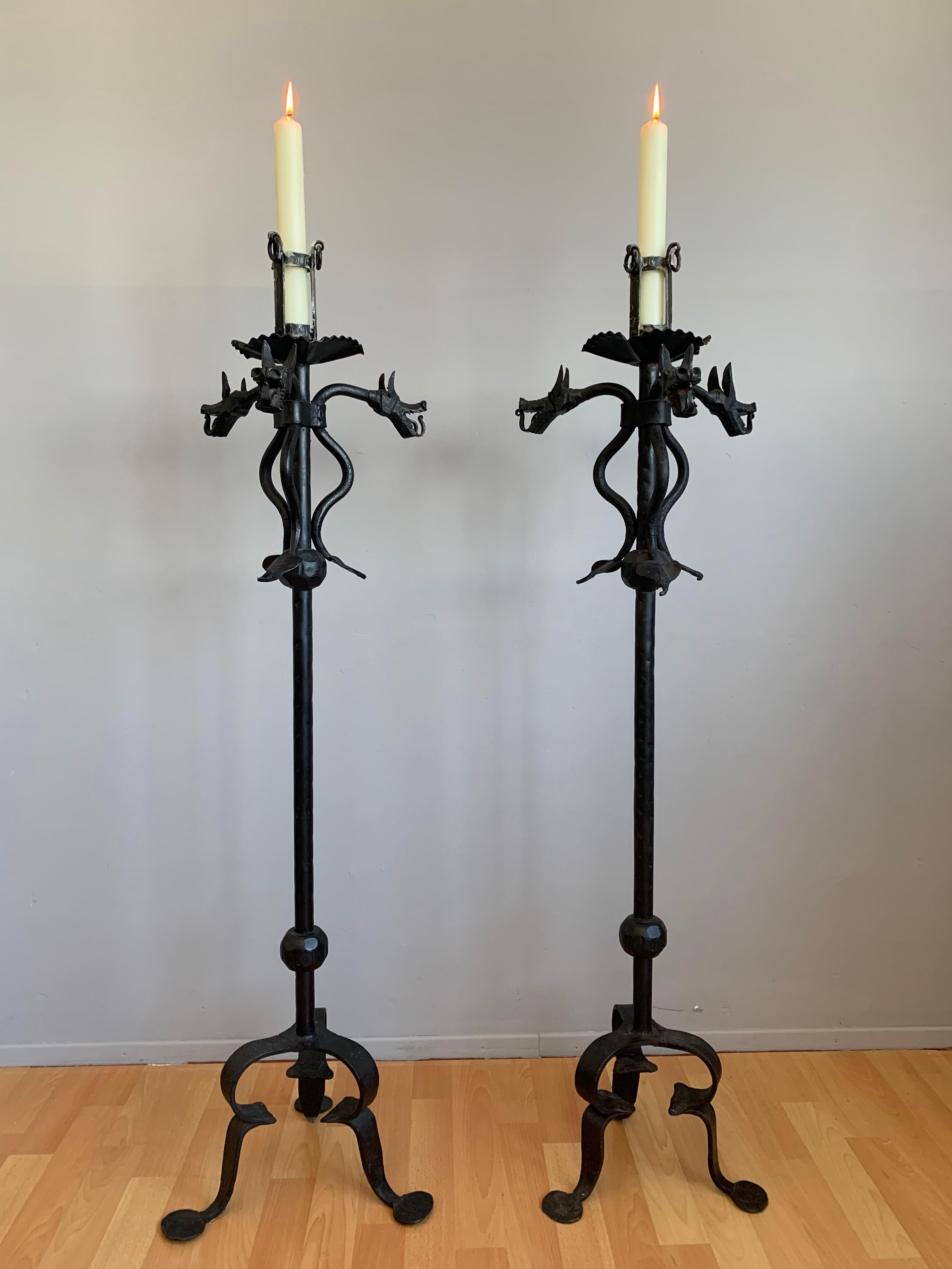 Gothic Revival pair of sculptural and highly decorative, wrought iron candle holders.

If you appreciate decorative antiques in general and you are looking for a pair of floor candlesticks in particular then this rare and all hand-crafted pair in