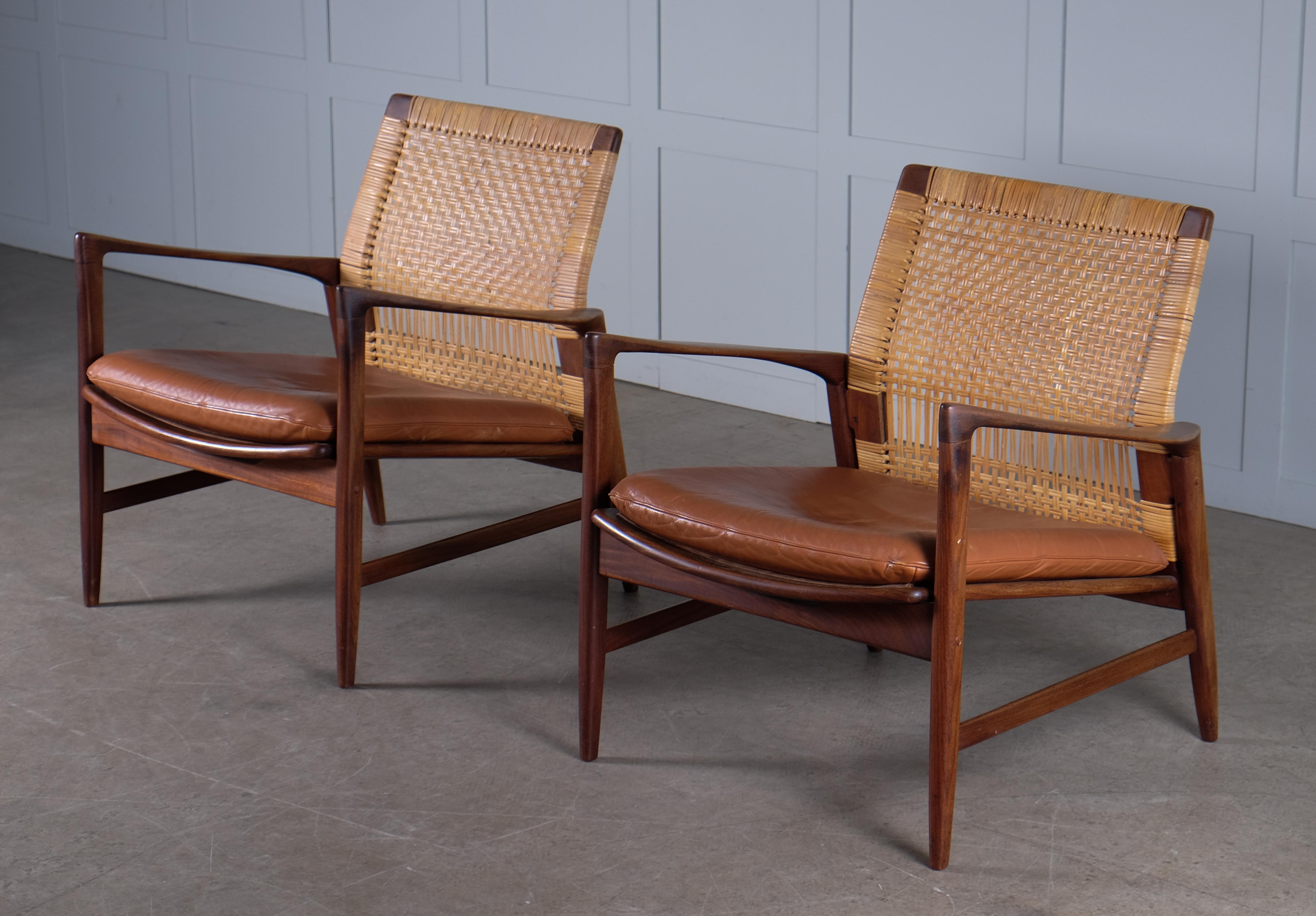 Rare model, produced by OPE, Sweden, 1960s.
Afromosia, rattan/cane and newly reupholstered cushions in leather.