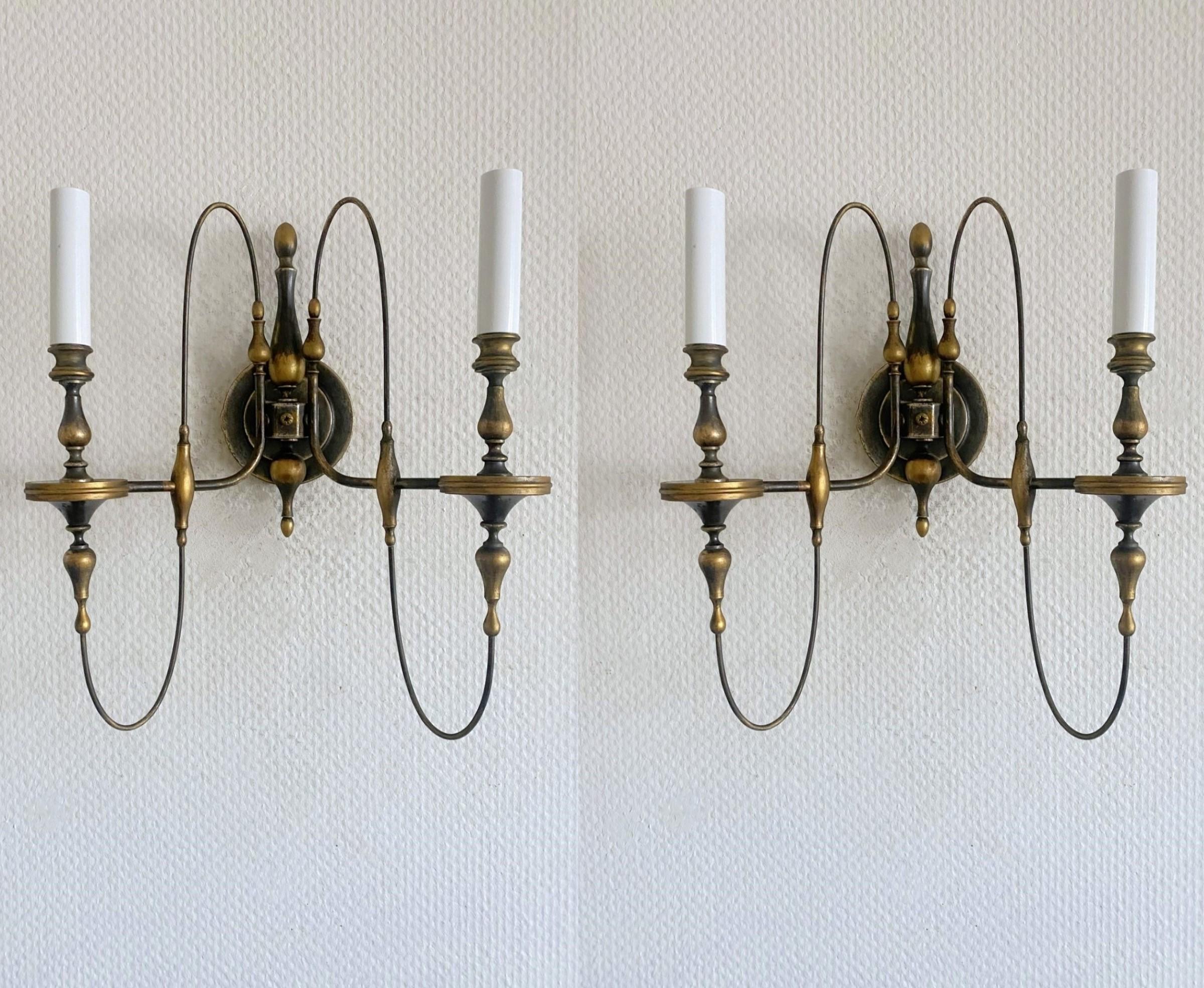 Rare pair of large brass parcel patined 2-branch wall sconces by Gaetano Sciolary, Italy, 1950s, in elegant Art deco design with original metal  candle sleeves. Sciolari brand engraved on the back plate. Both sconces in fine vintage condition,