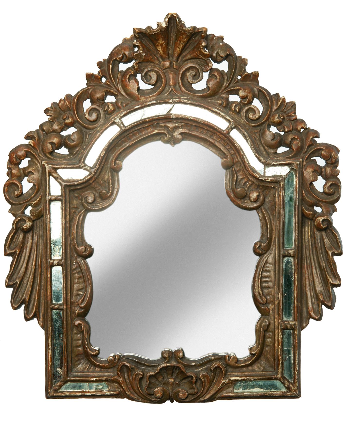 Early 19th Century rustic giltwood antique Italian mirrors: a pair 
Hand carved giltwood surrounds the mirror in mosaic with small, embedded mirror & elaborate carving.
