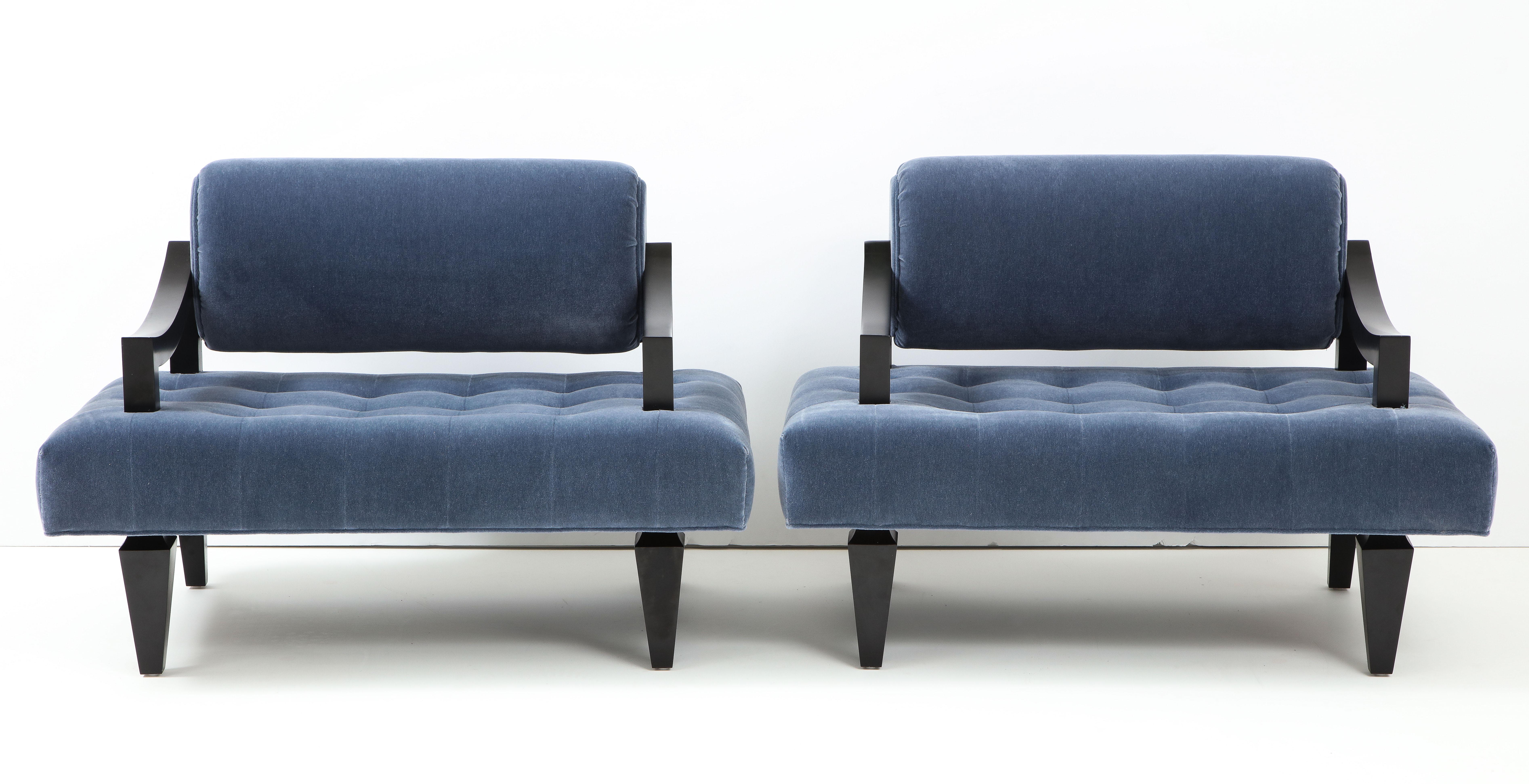 Exquisite pair of rare lounge chairs by James Mont.
The wide framed chairs have been fully restored with satin black frames and Mohair upholstery which is tufted on the seats.