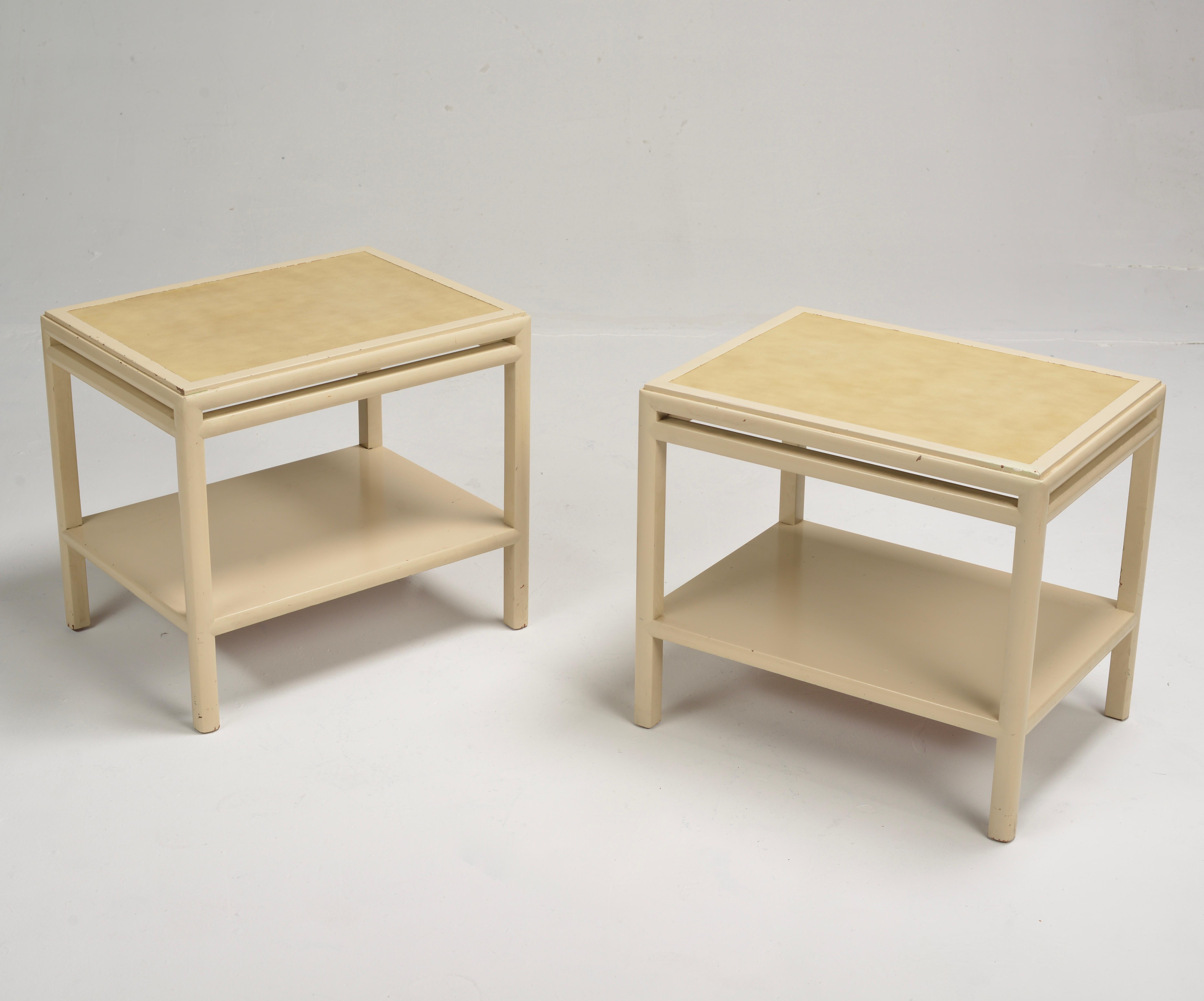 Stunning Pair of leather topped end tables designed by Johan Tapp circa 1940. These hand-crafted tables are constructed of solid maple with gorgeous inlayed leather tops. The original cream lacquer finish and simple but elegant details bring a