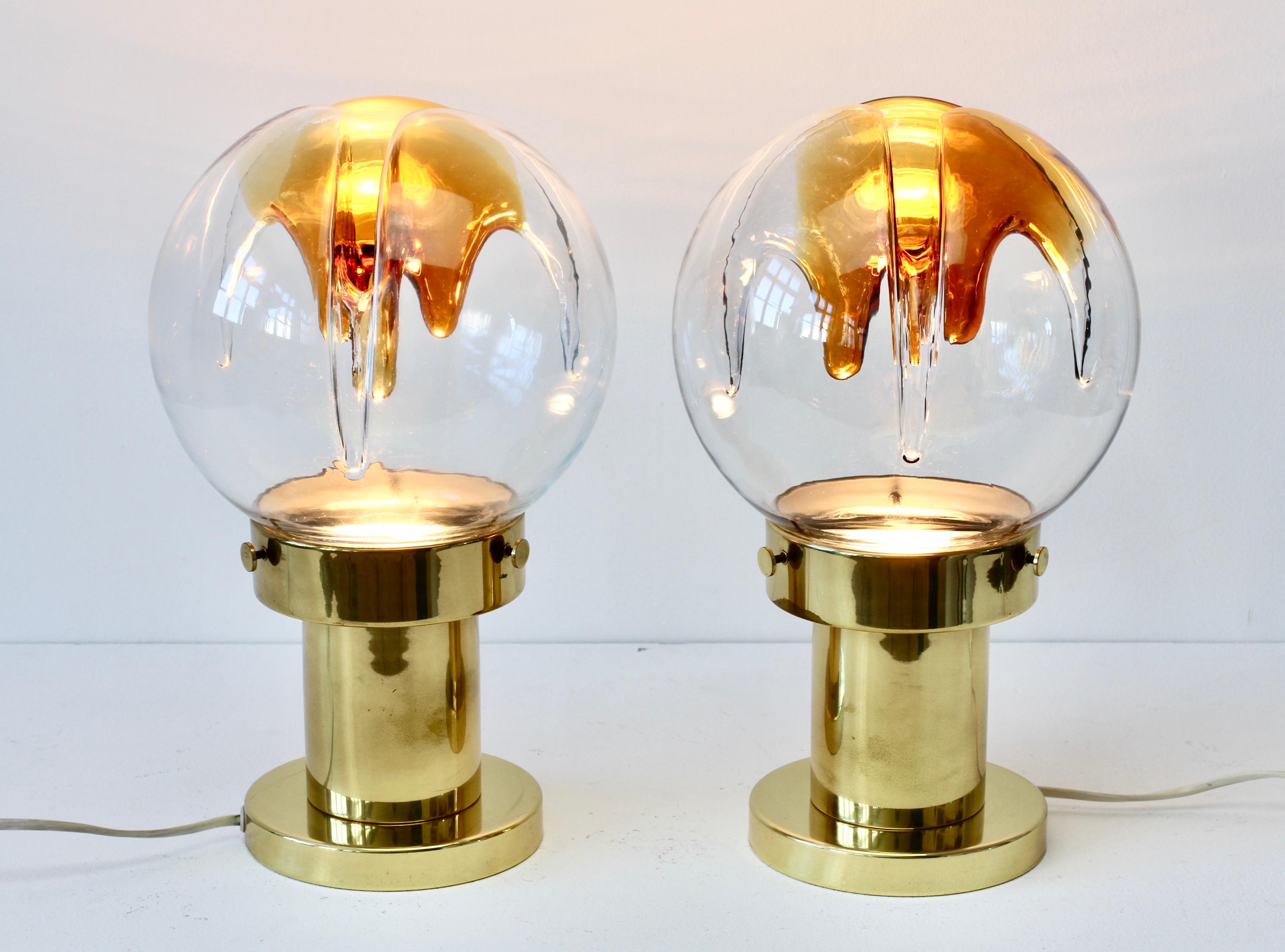 Midcentury pair of vintage textured glass and polished brass table lamps by Kaiser Leuchten with textured coloured Murano glass shade attributed to Mazzega, circa 1970s. A fantastic design featuring wonderfully textured biomorphic clear and orange /