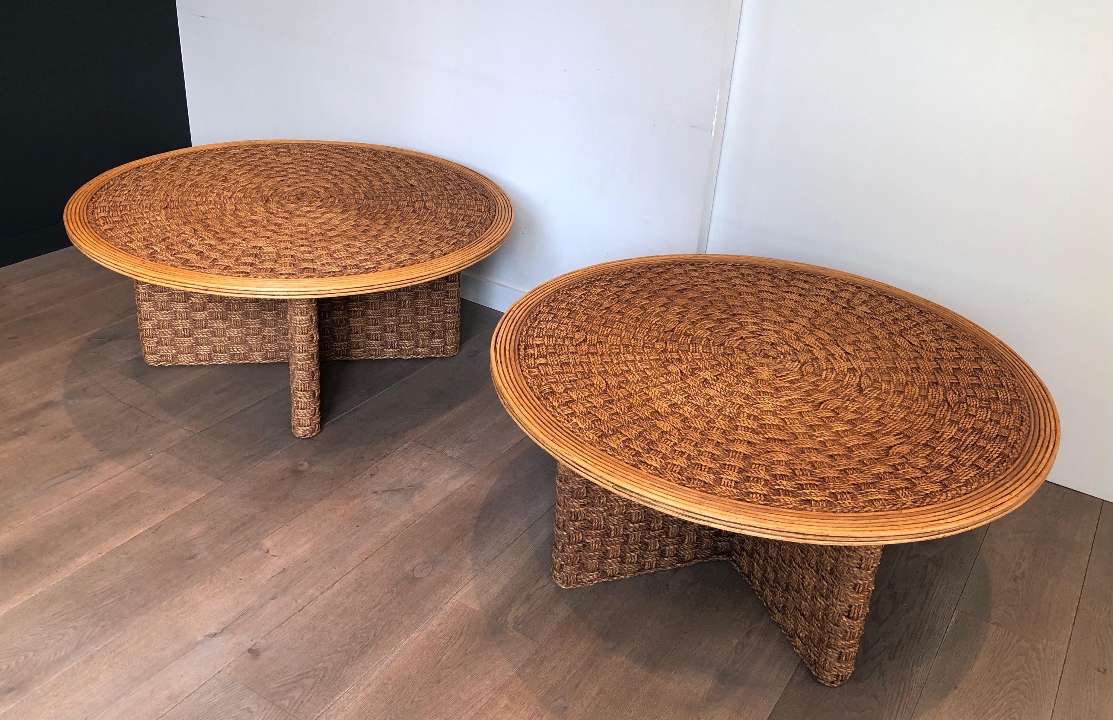 This is a rare pair of large round coffee tables. These tables are made of wood and of a very nice and fine rope work. This is a French work in the Style of Adrien Audoux and Frida Minet (Audoux Minet). Circa 1970