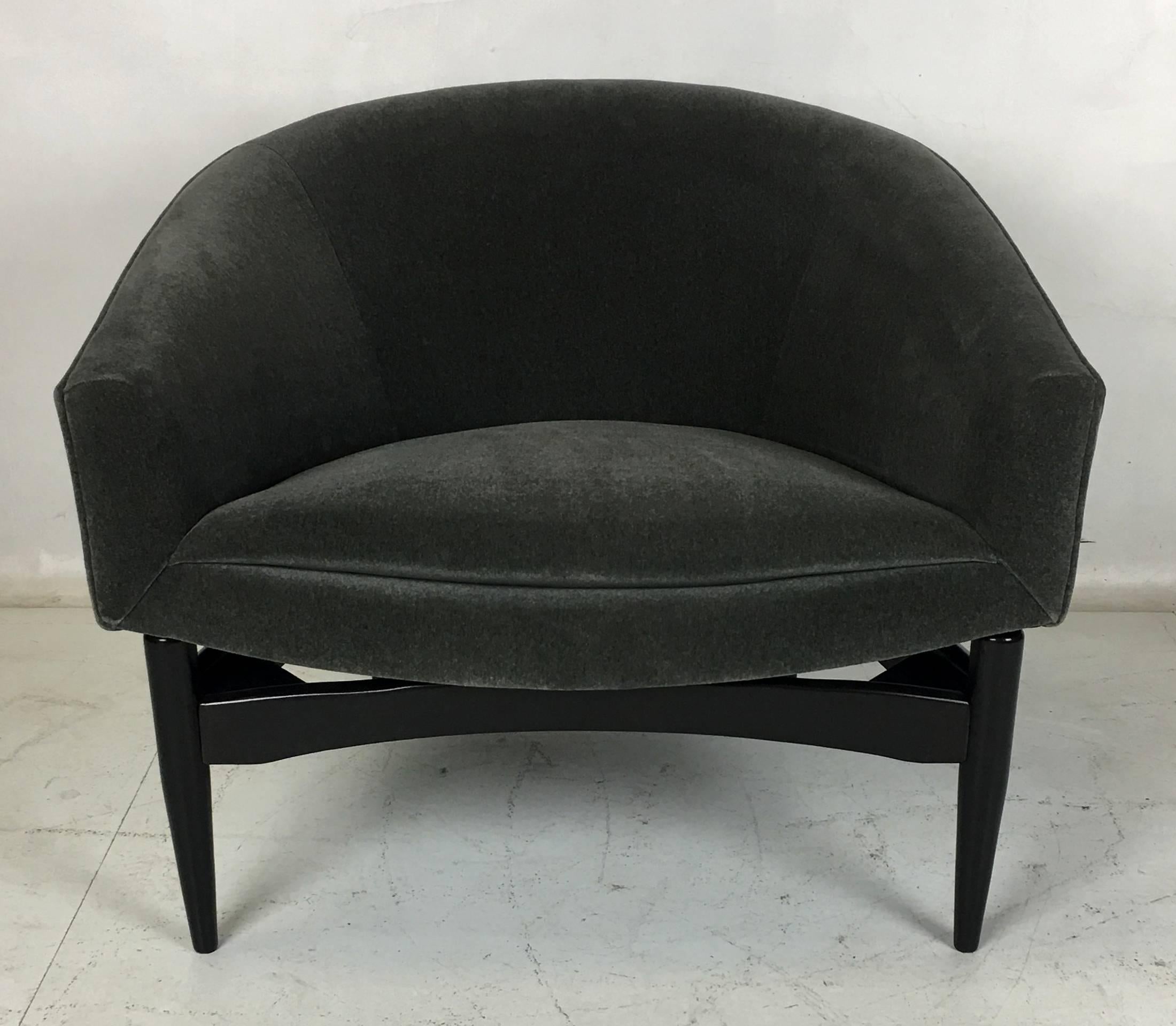 Sensational pair of wide and comfortable Lawrence Peabody Lounge chairs. The pair have been meticulously restored, the bases re-glued and refinished in Ebony lacquer and the chairs have been re-upholstered in luxurious heavyweight Charcoal Grey