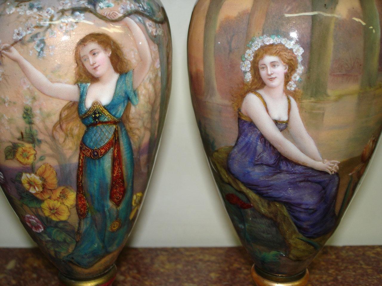 A rare pair of late 19th century French enamel vases

The front with a maiden in the woods, the sides and back with flowers and landscape scenes.