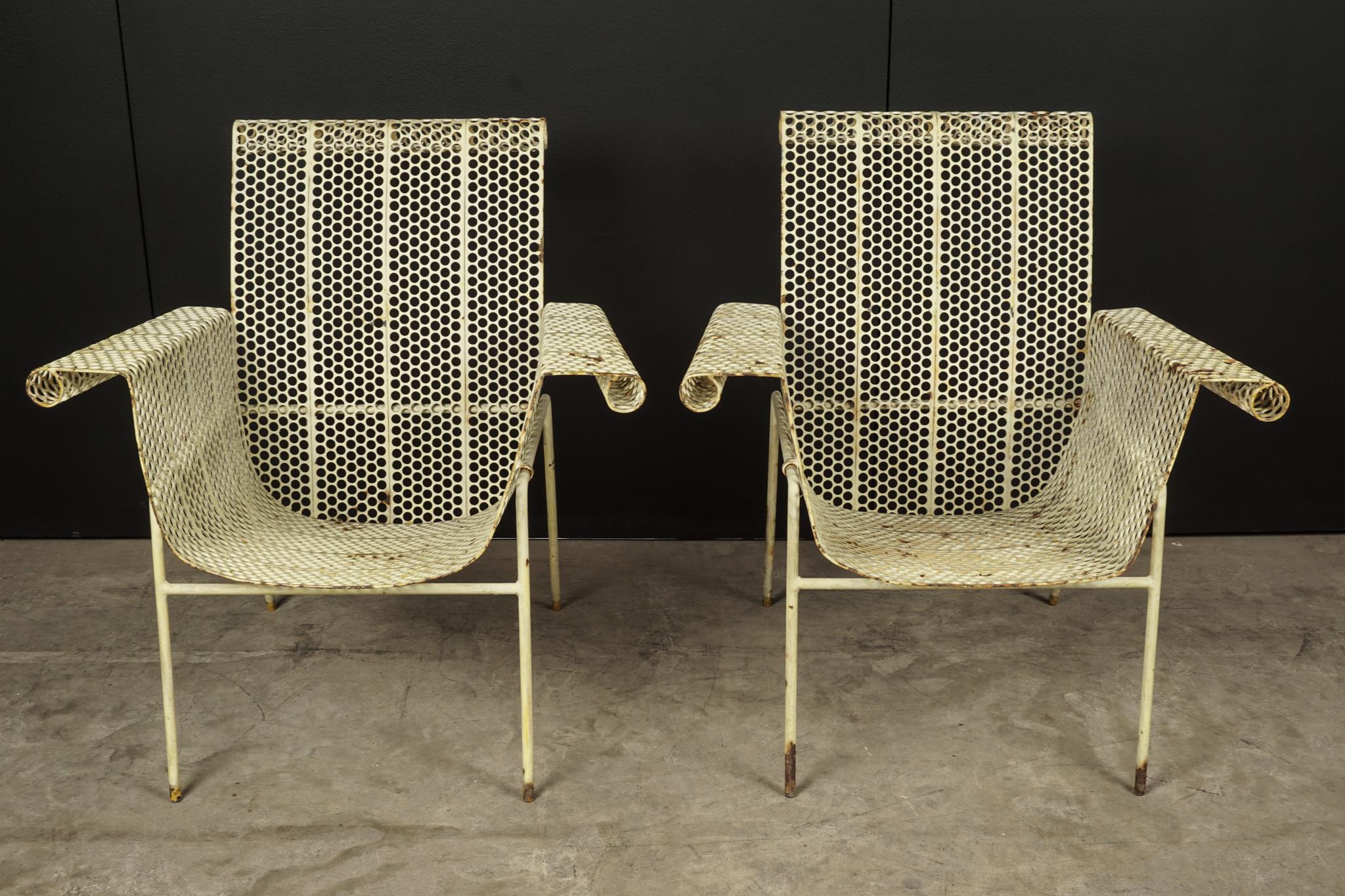 Rare pair of lounge chairs designed by Rene Malaval, France, 1940s. Perforated metal construction in original paint.
