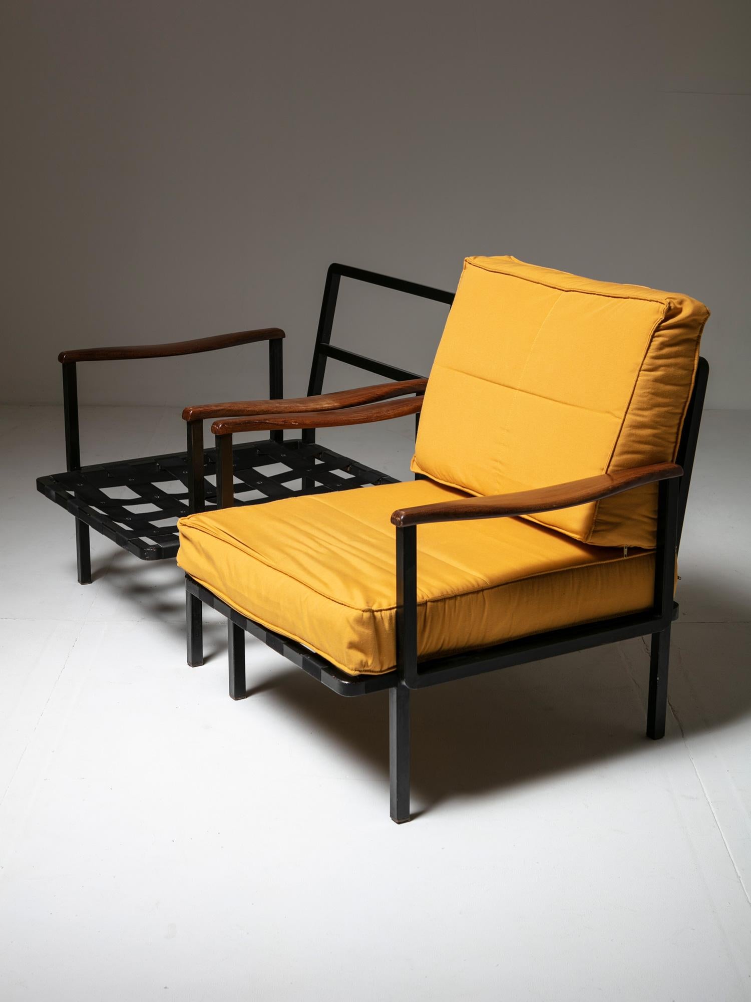 Lounge chairs model P24 by Osvaldo Borsani for Tecno.
Surprising combination of sleek wood armrests on metal frame.