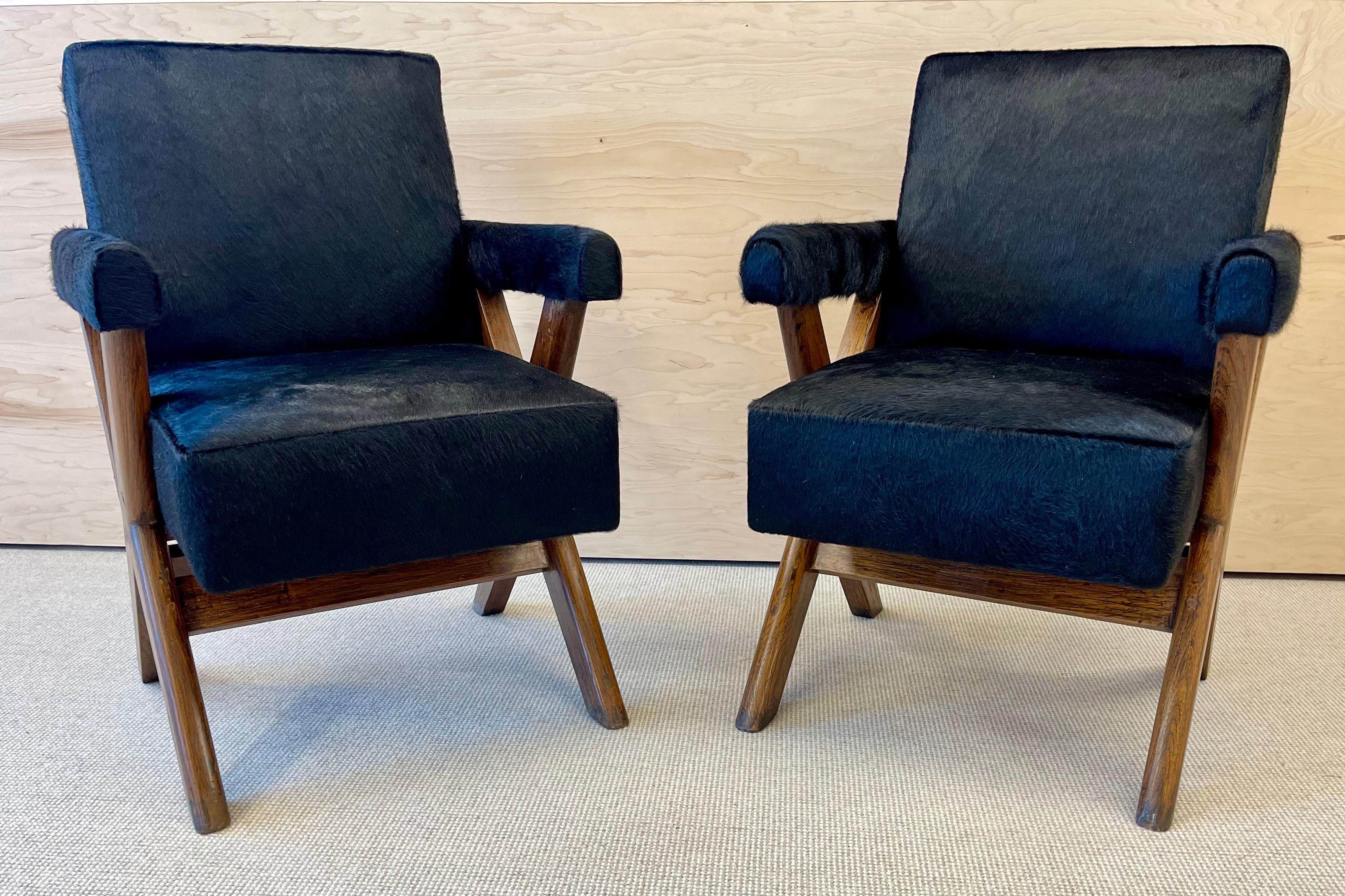 A rare pair of X-Leg ‘Committee’ chairs, c. 1960 attributed to Pierre Jeanneret
Model PJ-SI-50-A
Provenance: Chandigarh, India 1ggSX
 
Newly upholstered in a luxurious black cowhide - making these works extremely chic. New springs have been added in