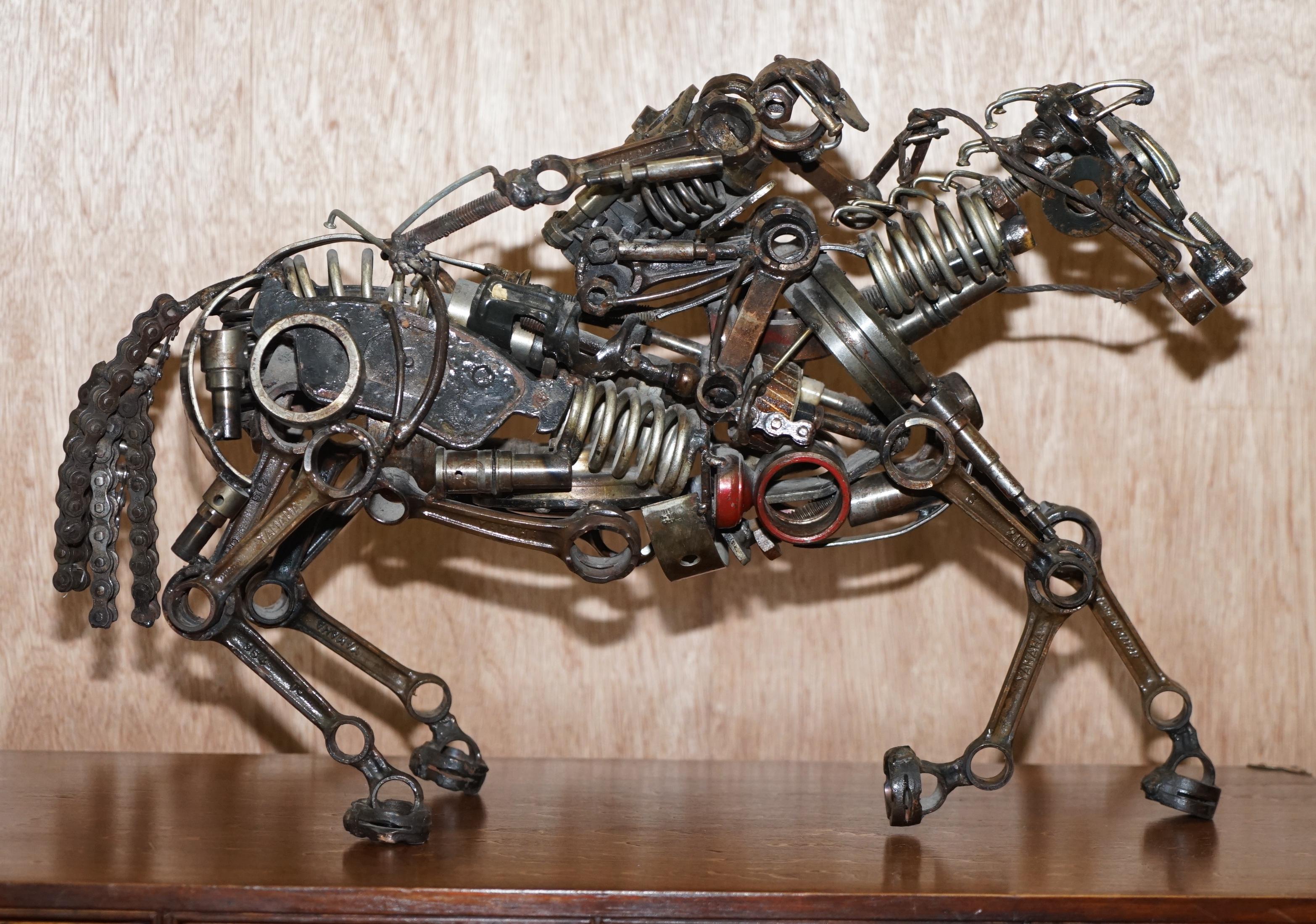 We are delighted to offer for sale this lovely pair of sculptures made from vintage Motorcycle parts depicting two solders on horses

A very good looking well made and decorative pair, each one is naturally quite heavy, you can see various