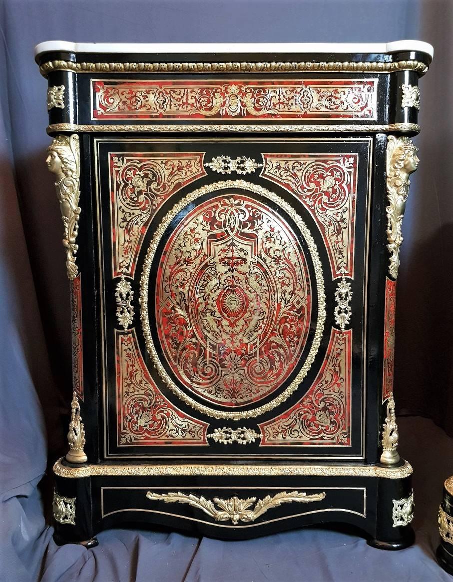 Rare pair of Napoleon III cabinet in excellent condition in Boulle style marquetry negatif/positif details inlay of brass/and red horn.
Different marquetry decoration as characters, angels, flowers, etc.
Gorgeous gilt bronze ornamentation, white