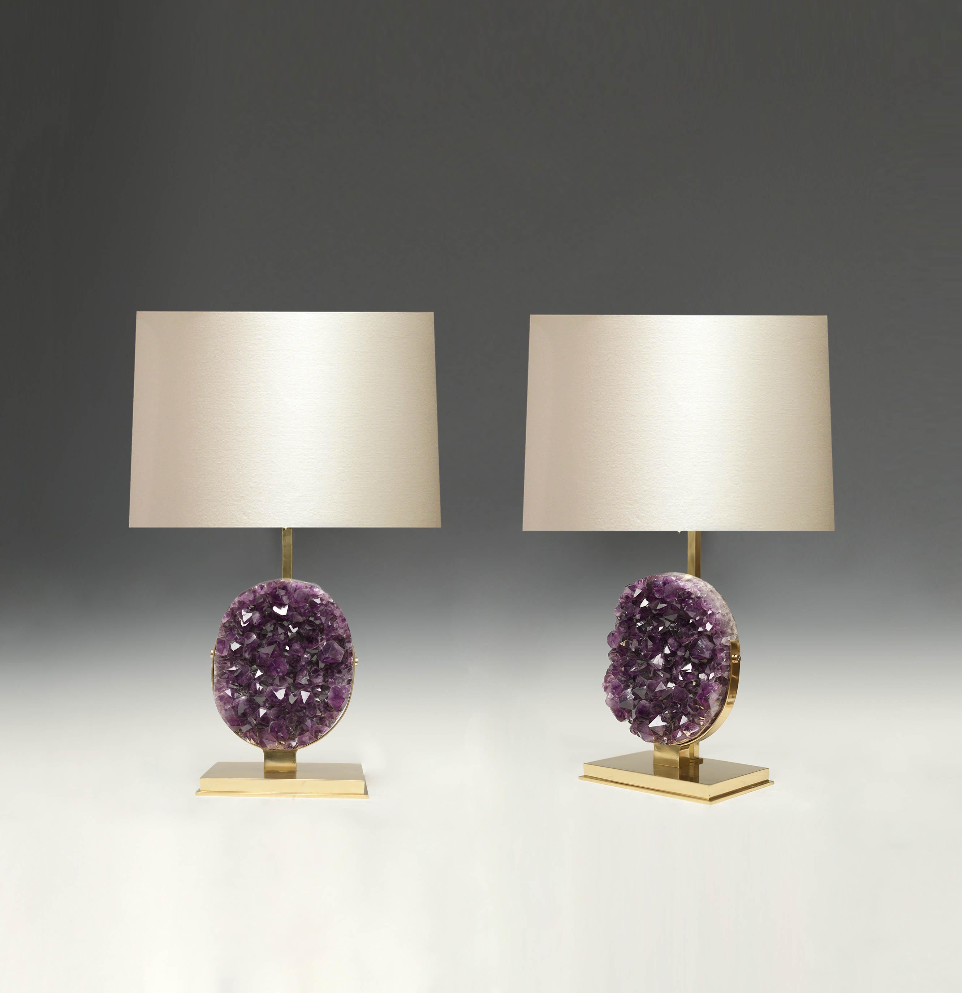 Pair of natural amethyst sculptures mount as lamps with polish brass stands. Created by Phoenix gallery NYC.
To the top of amethyst is 12.25in.
Each lamp installs two sockets.
Lampshade do not include.