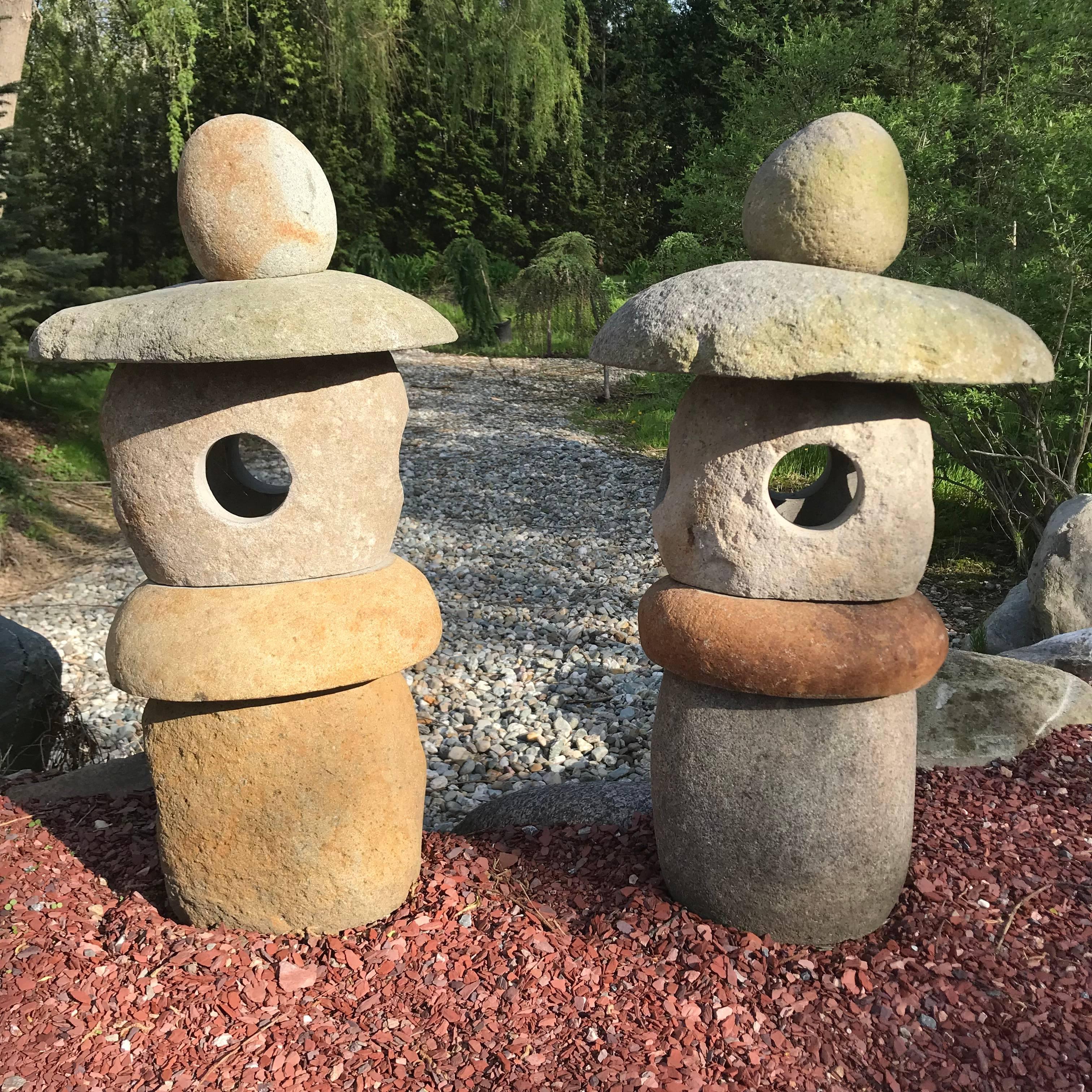Here's an unusual opportunity to acquire a pair (2) of very nice sized stone -Spirit- lanterns carved from natural boulders and ideally suited for a small to medium garden out of doors or inside in your favorite sun space. 

The striking and well