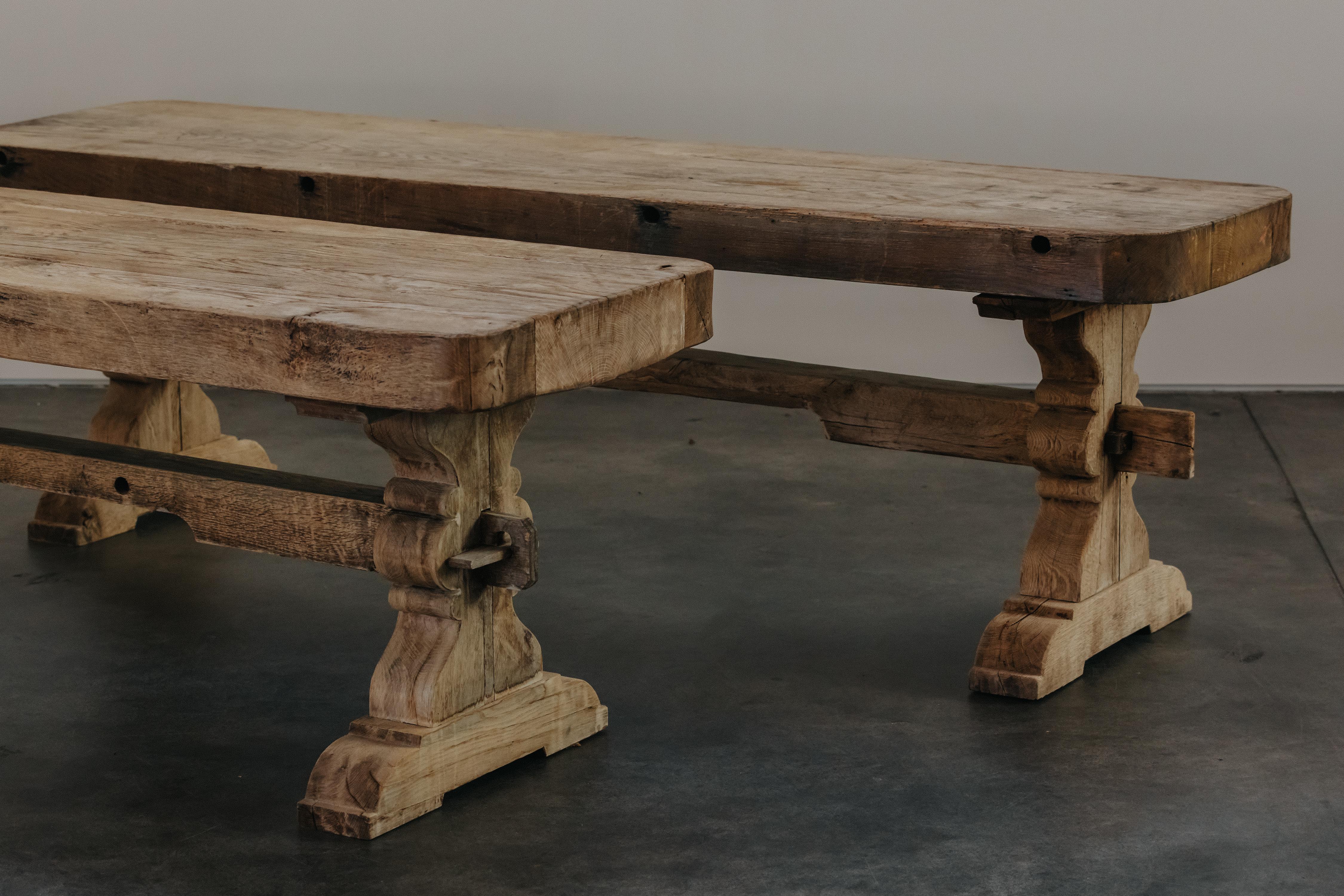 Rare Pair Of Oak Wine Tasting Tables From France, Circa 1880.  Heavy, solid oak construction with superb patina and use. 