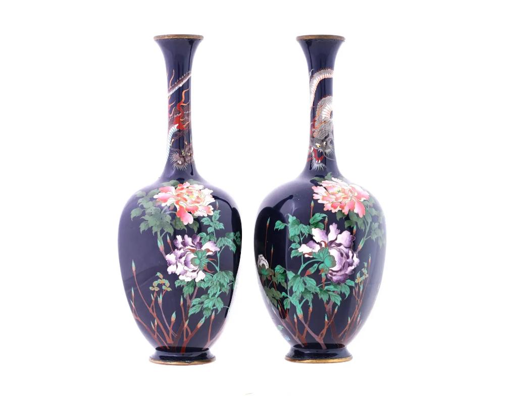A set of two Japanese vases, Meiji era, 1868 to 1912. Two high quality antique vases of an ovoid form tapering to the bottom and bearing a long neck tapering to the upper rim. The exterior is decorated with finely detailed polychrome designs