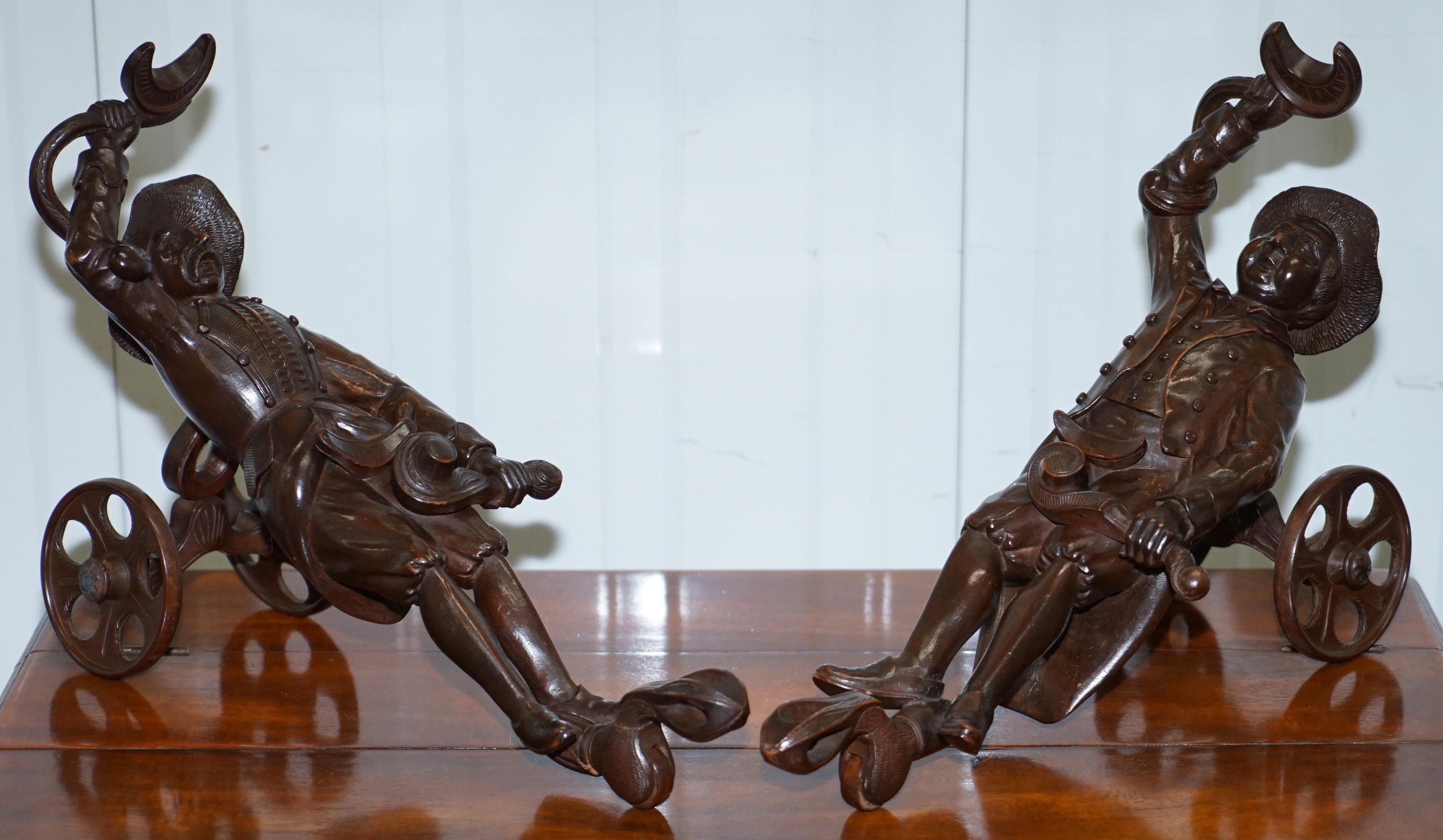 We are delighted to offer for sale this lovely pair of original Brienz Switzerland black forest wood hand carved 19th century wine bottle holders

This pair are exquisite from top to bottom, the carving is obviously done by a master craftsman, we