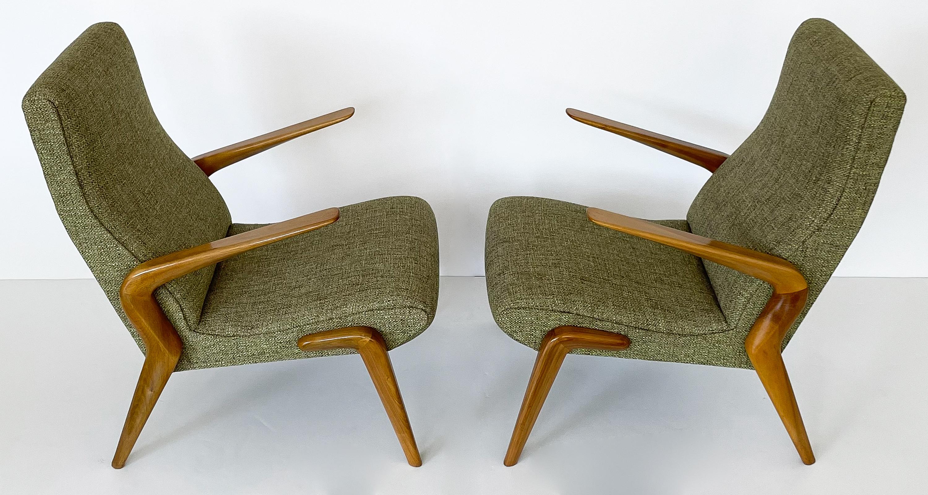 Rare and important pair of Osvaldo Borsani P71 armchairs in Italian walnut and produced by his company, Tecno, Italy. Designed in 1954 the P71 chair was one of the first designs produced by Tecno and was exhibited at the Milan Triennale in 1954.
