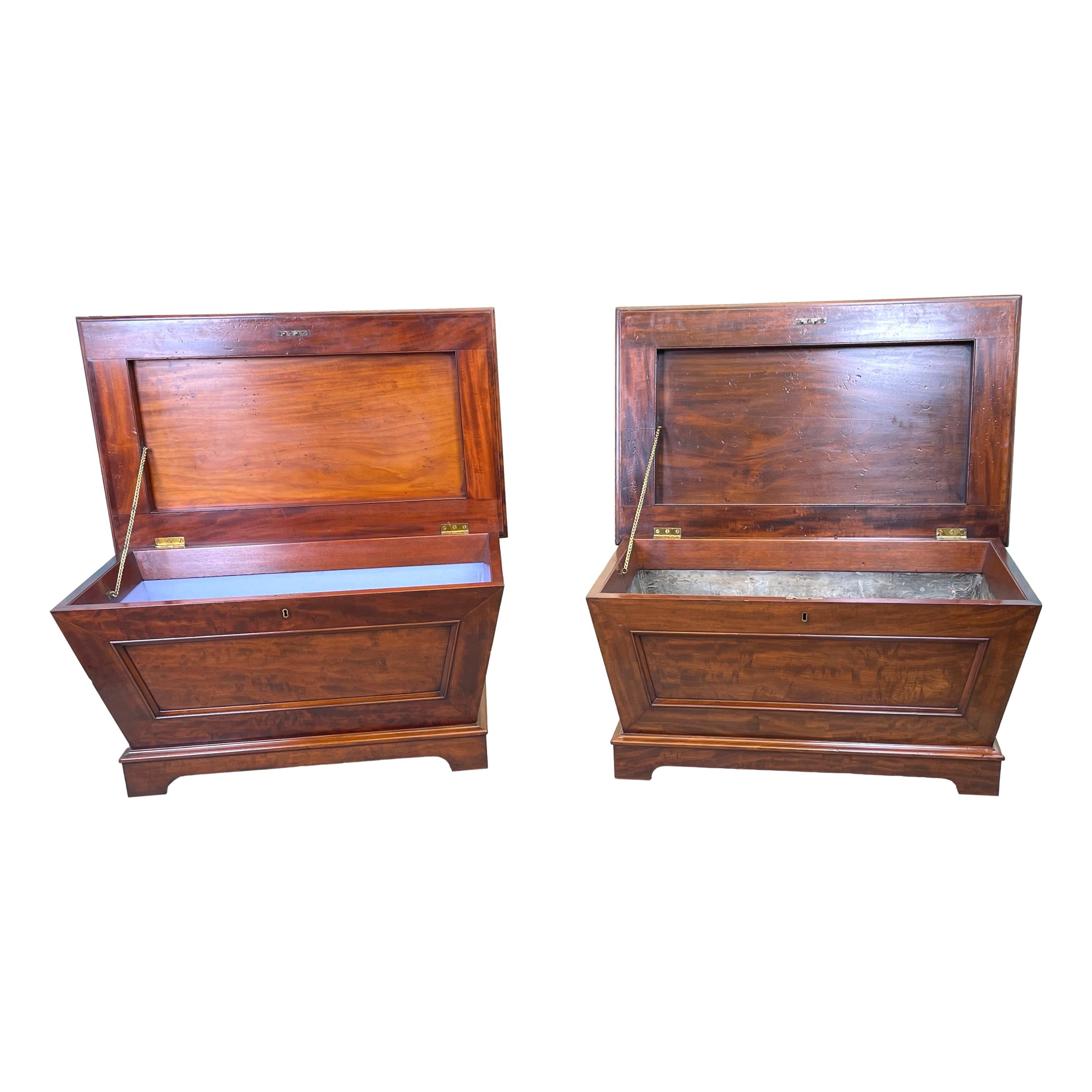 A very fine quality and extremely rare matched pair
of regency mahogany cellarettes, or wine coolers,
of bold proportions and sarcophagus design, each
With superbly carved knob to hinged lid, enclosing
Lead lining to one and later paper lining to