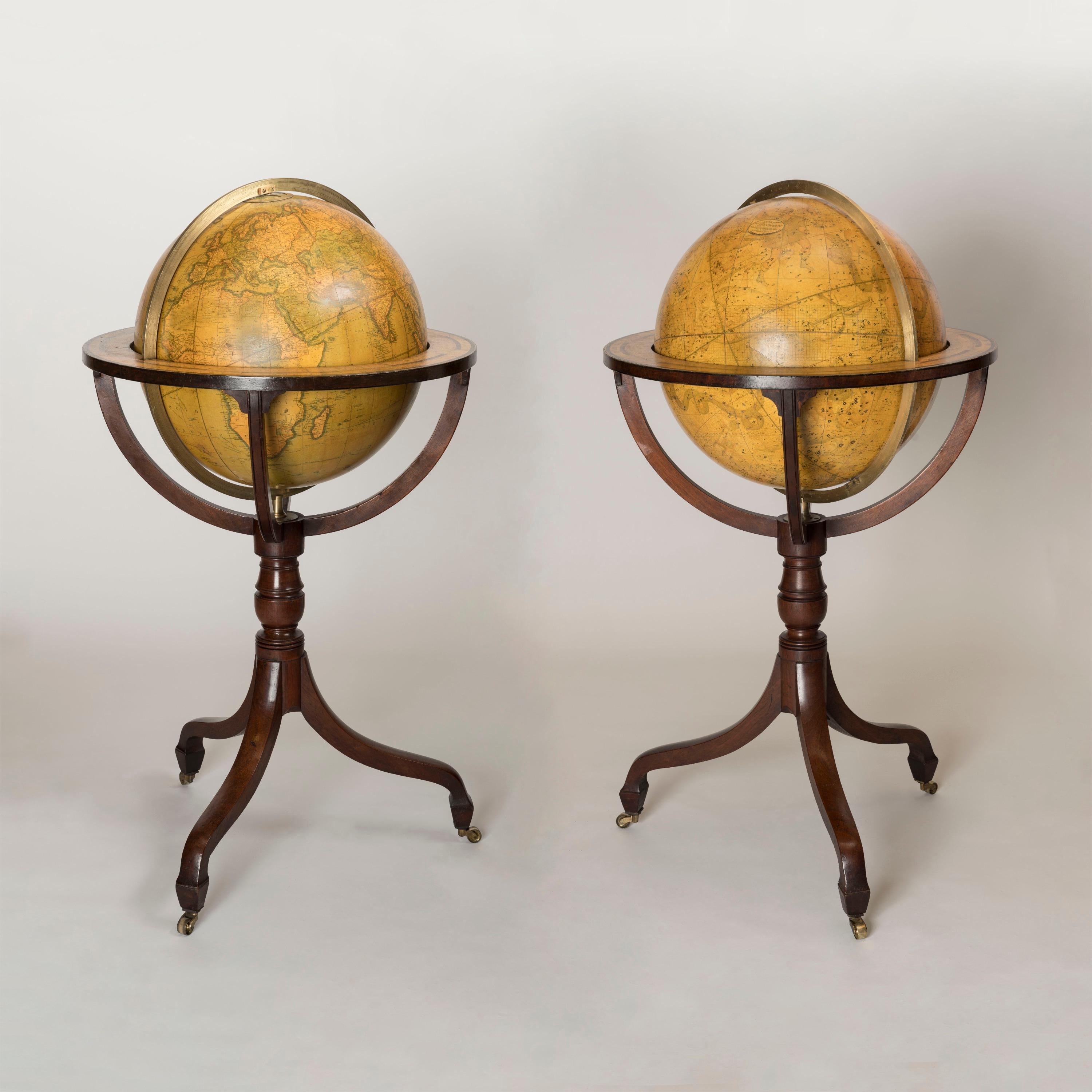 A Pair of Regency 18-Inch Globes
by J&W Cary

A pair of 18-inch globes, set in finely crafted mahogany stands, rising from a tripod base with brass castors for ease of movement, having inswept legs and a brass meridian ring.
English, circa 1820

The