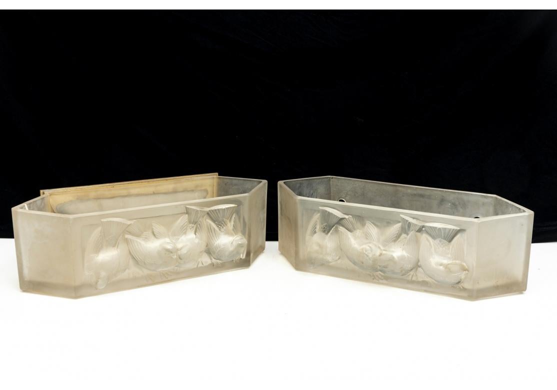 Pair of rare Rene Lalique Art Deco frosted and clear glass wall sconces with relief sparrow birds. Embossed signature R. Lalique lower right. Bronze rectangular backplate.
Dimensions: 17 1/2