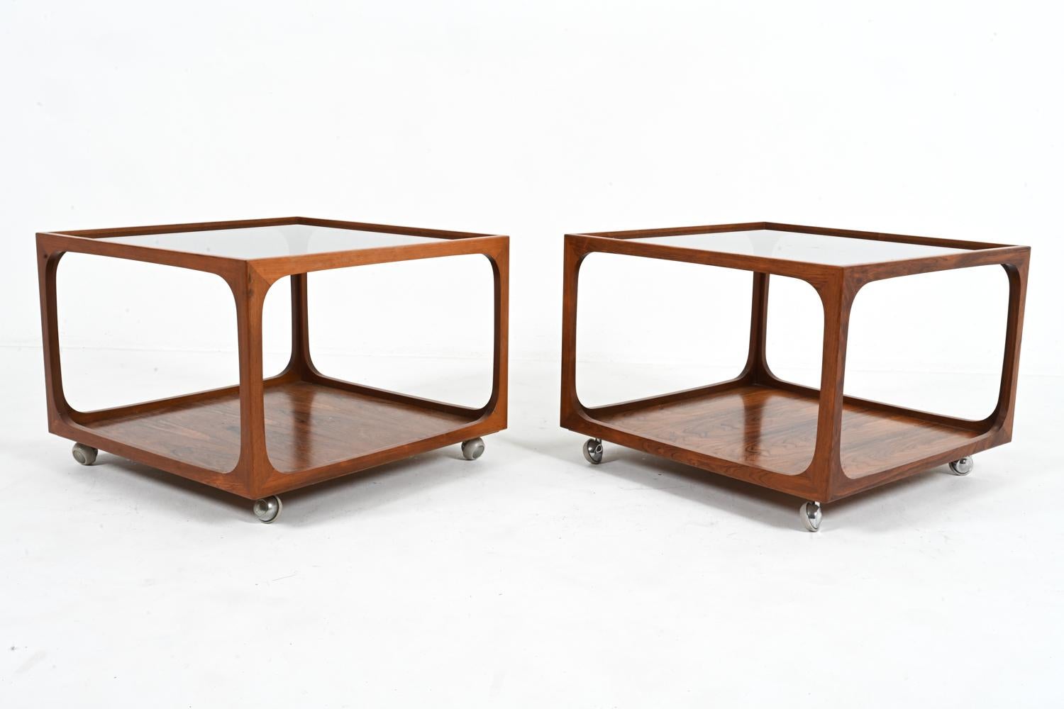 Channel Mid-Century Modern elegance with this exquisite and rare pair of  cocktail tables attributed to the German maker Wilhelm Renz. 

Imbued with the timeless spirit of 1970's design, this exceptional pair of tables embodies the glamour and