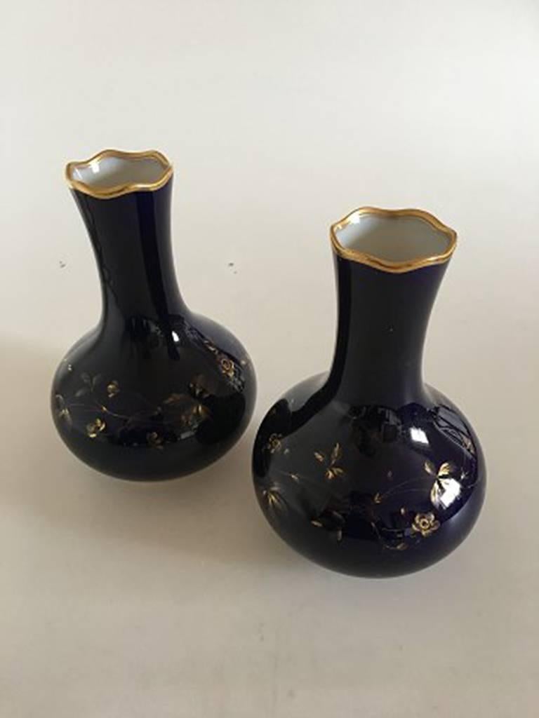 Rare pair of Royal Copenhagen Art Nouveau cobolt blue vases with gold decorations. With rare blue export marks, most probably for Russia. Measure: 20.5 cm and are in perfect condition.
