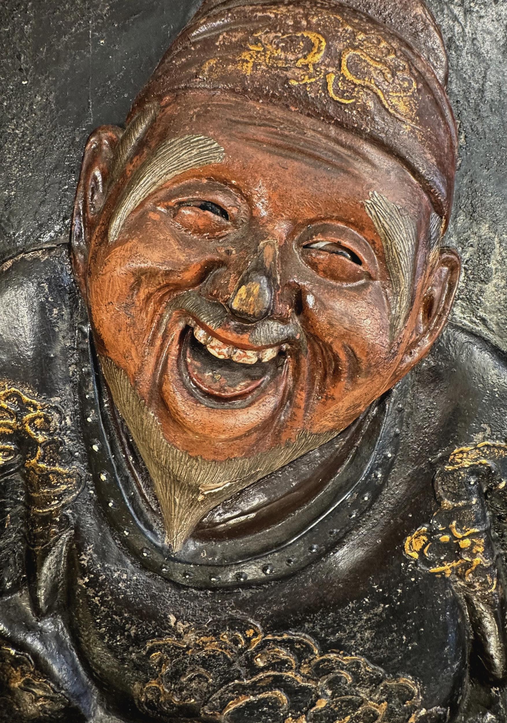 Rare pair of late 19th century sconces, each consisting of a carved wood and papier-mâché panel lacquered with gold highlights, adorned with a Chinese character with glass sulfide eyes (like the dolls).
Two light arms. Later electrification.