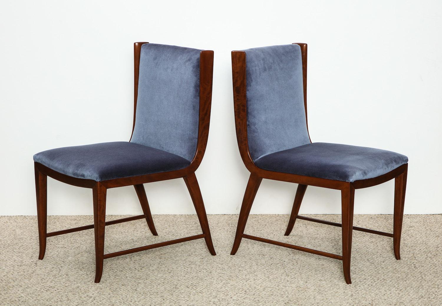 Stylized wood frames with upholstered seats and backs. An elegant and rare form.