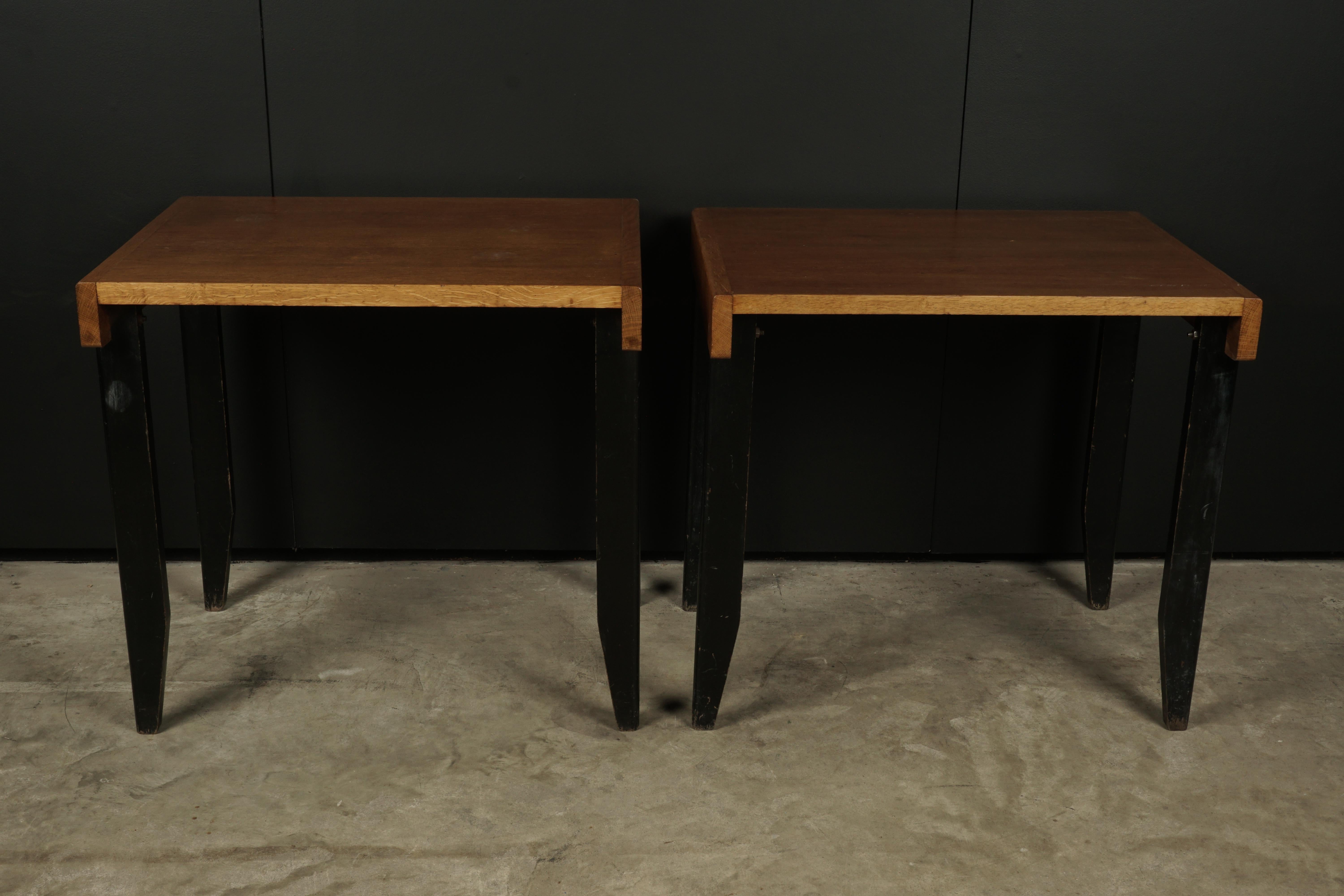 Rare vintage pair of side tables from France, circa 1960. Solid oak construction with brass hardware. Unknown designer.