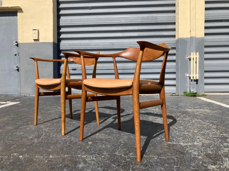Rare pair of sigurd ressell arm chairs for Niels Vodder. Oak and leather seats. Foam and leather have recently been replaced, Rotex webbing is original. One chair still has the original Georg Jensen label marked April 1967.
Chairs are in good