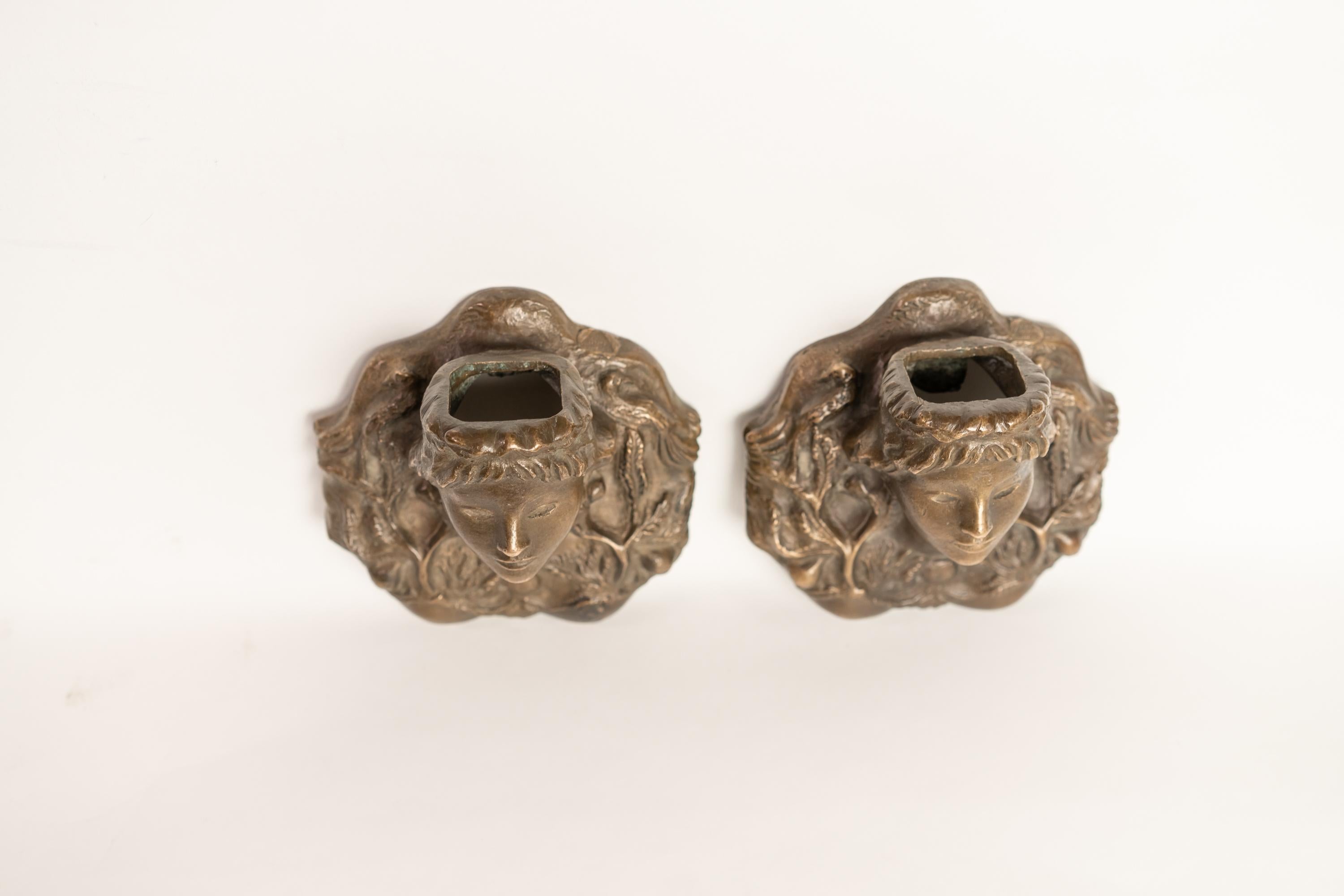 Rare pair of solid bronze sconces by Vadim Androusov representing females figures in Merovingian style. Signed: 