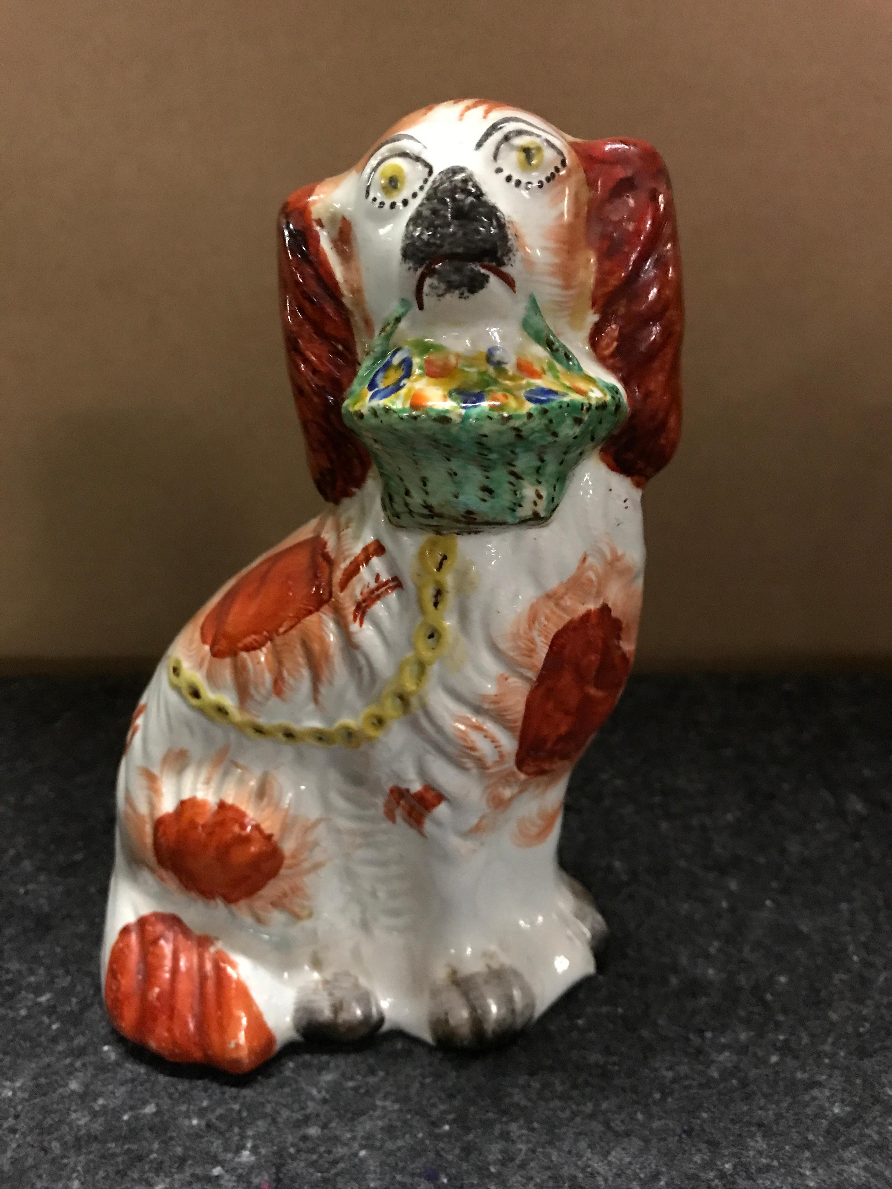 Rare Pair of Staffordshire Seated Red Spaniels with Baskets of Flowers For Sale 1