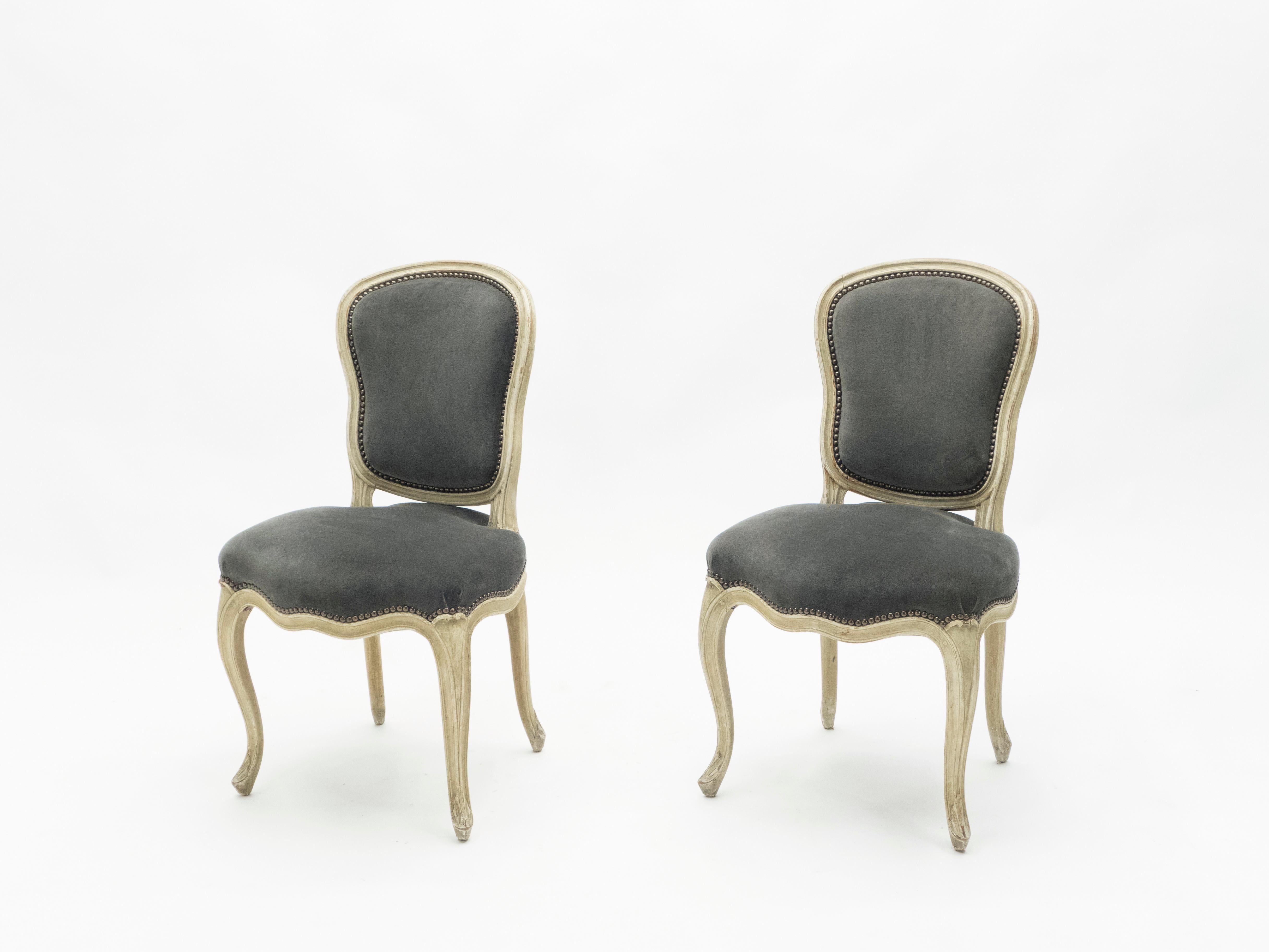 The construction of this pair of chairs was deeply cared about, and it shows in the finished product, even some eight decades later. The chairs were made and stamped by French firm Maison Jansen in the early 1940s in their pure Neoclassical Louis XV