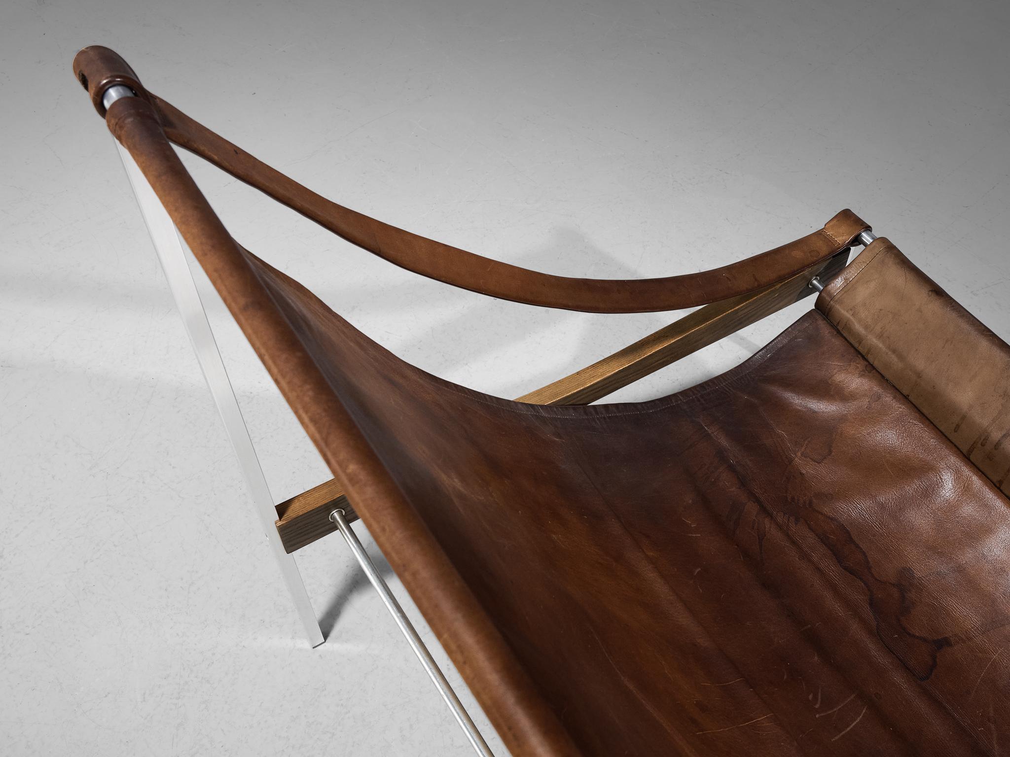 Mid-20th Century Rare Pair of Stig Poulsson 'Bequem' Lounge Chairs in Cognac Leather