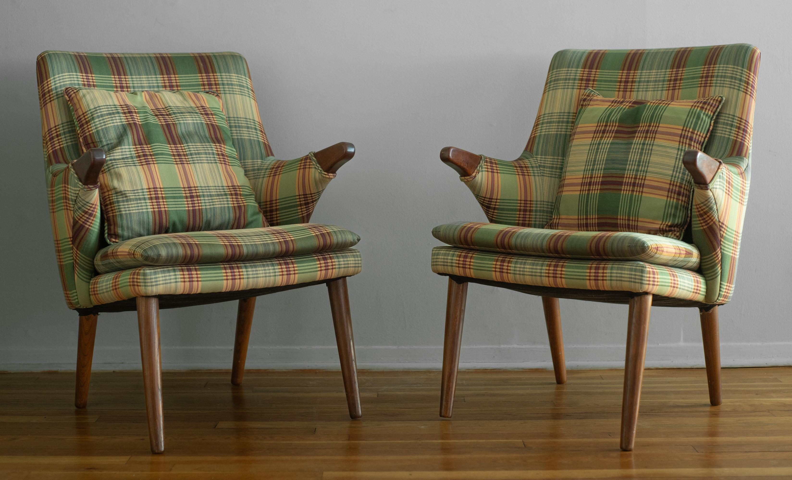 Designed by Svend Skipper, these rarely seen armchairs serve as the little brothers for the Model 91, similar to Wegner's AP Stolen 