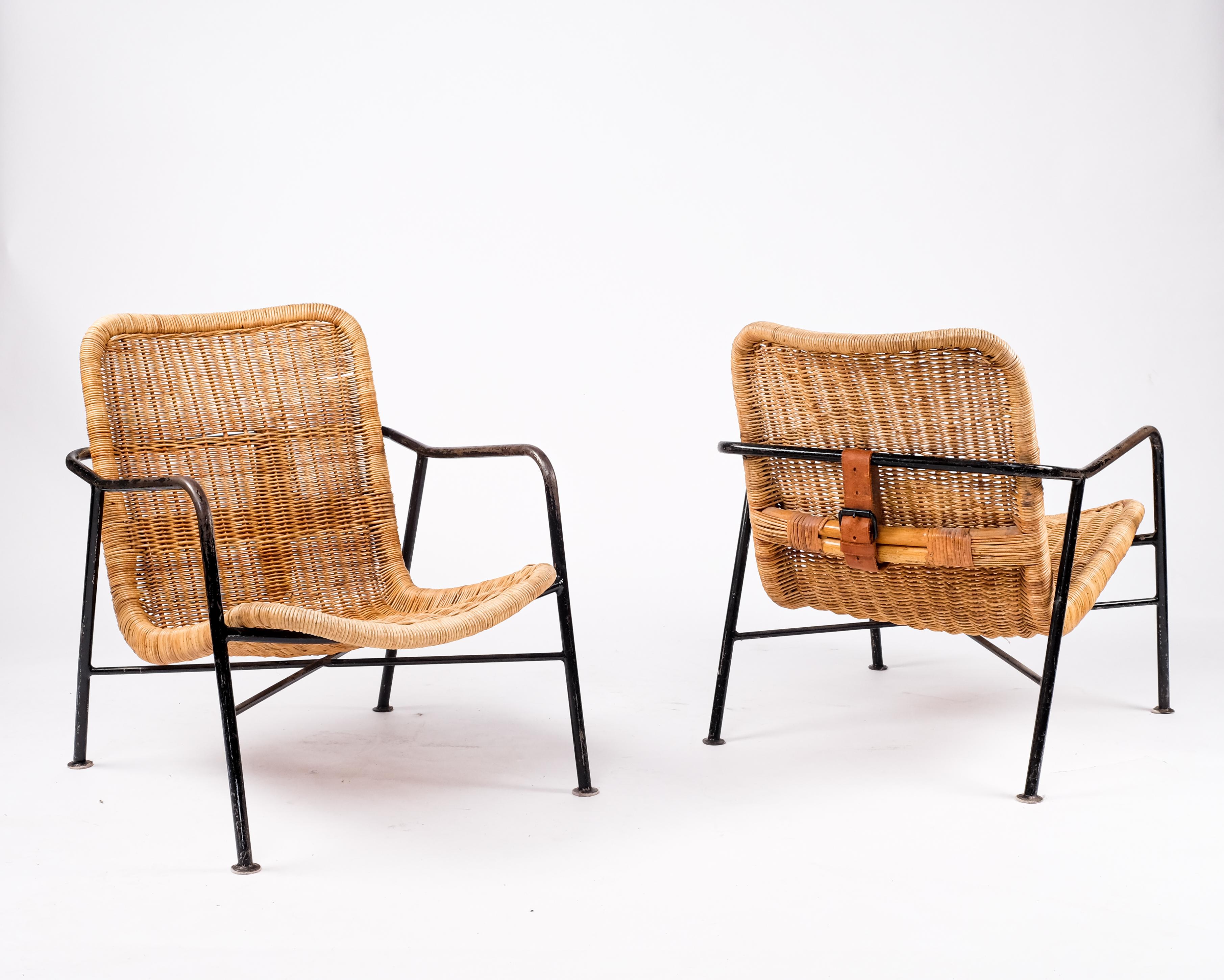 Produced in Sweden, 1960s.
Made from hand weaved wicker and black lacquered steel, original leather straps.
  