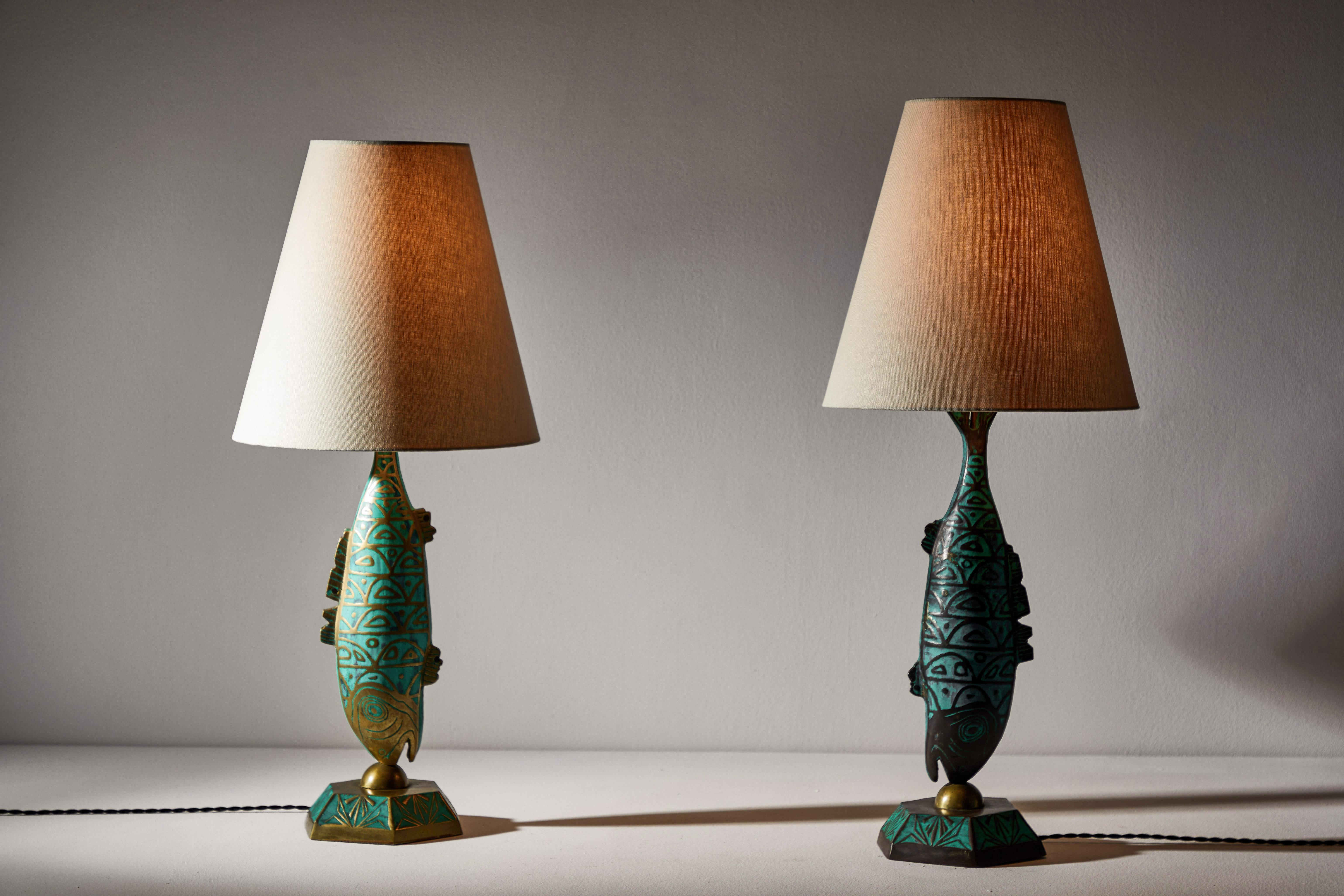 Rare pair of table lamps by Pepe Mendoza. Designed and manufactured in Mexico, circa 1950s. Brass with ceramic inlay and custom linen shades. Rewired for U.S. standards with black French twist cord. We recommend one E27 75w maximum bulb per light.