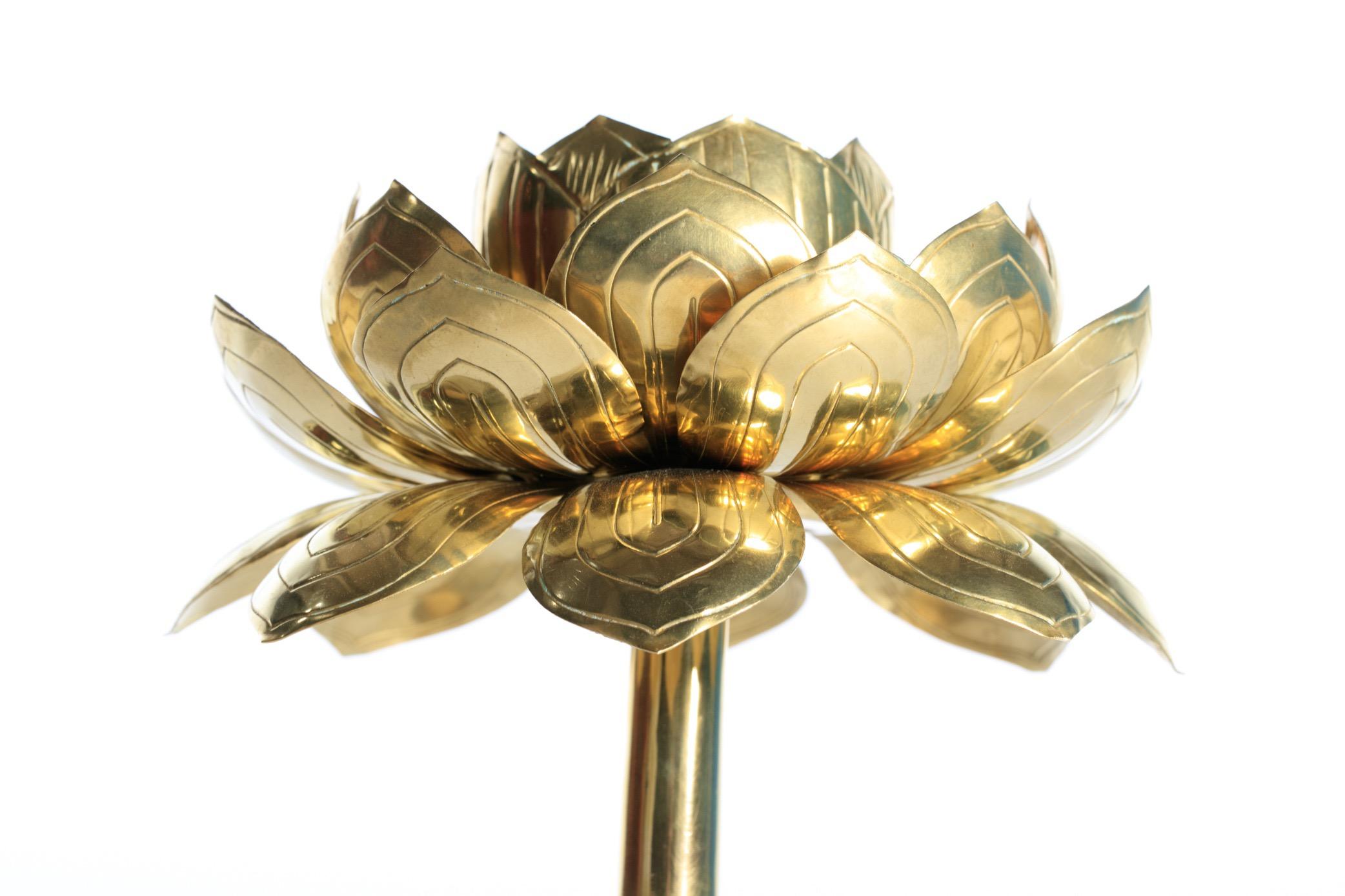 Exquisite and rare pair of delicate brass lotus flower, tall candle sticks by Feldman, circa 1960s. Beautifully polished and in the style of Parzinger, these candlesticks emit a beautiful glow and add ambiance and style to any dining table or