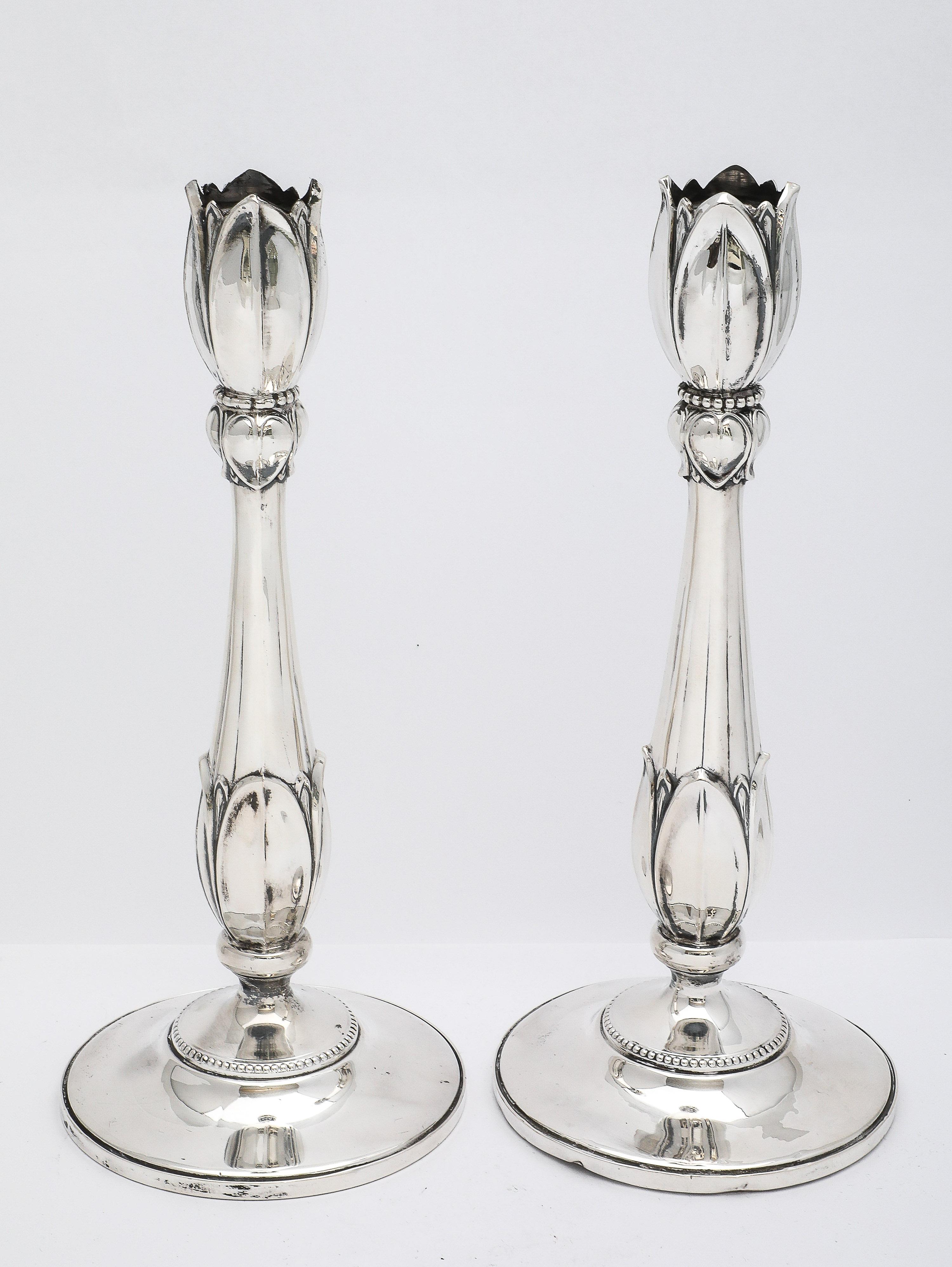 Rare pair of tall, sterling silver, Art Nouveau-Style, flower-form candlesticks, Fisher Silver Co., Jersey City, New Jersey, Ca. 1935. Beautifully and gracefully designed so that each candlestick appears to be a flower within a flower. Each