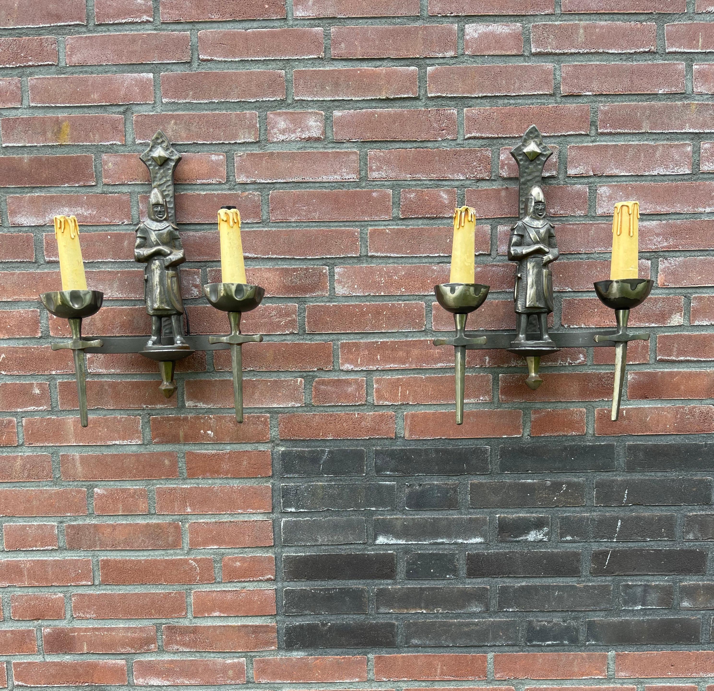 Stylish and highly decorative pair of Medieval Style sconces.

With 20th century lighting as one of our specialities, we have seen a lot of great and unique fixtures and only once before did we come across a pair of handcrafted Mediëval style
