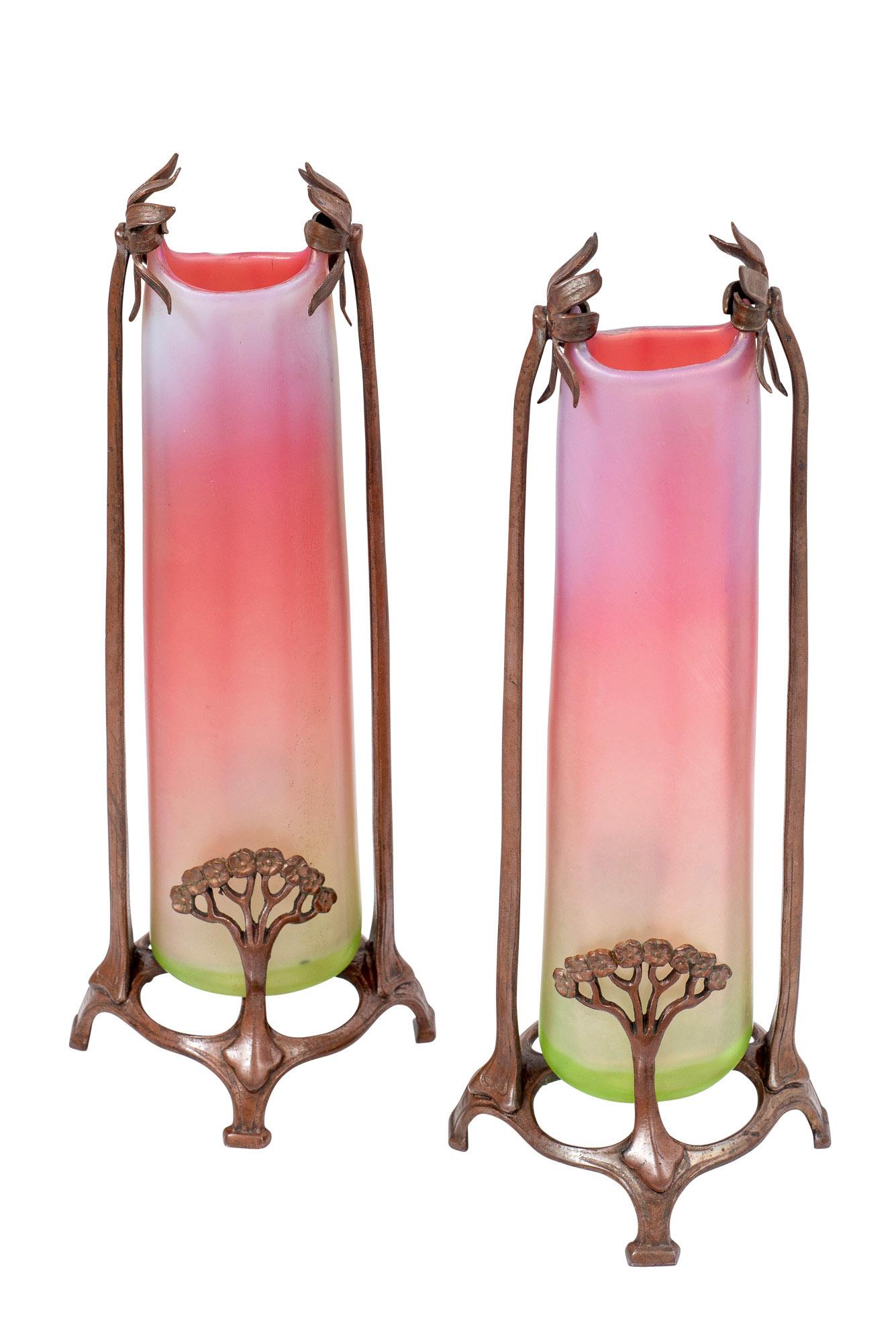This delightful pair of vases was made by Loetz on behalf of the Viennese glass publisher E. Bakalowits Söhne and was decorated with an exquisite red bronze metal mount. Combinations of different materials were very popular during the Viennese