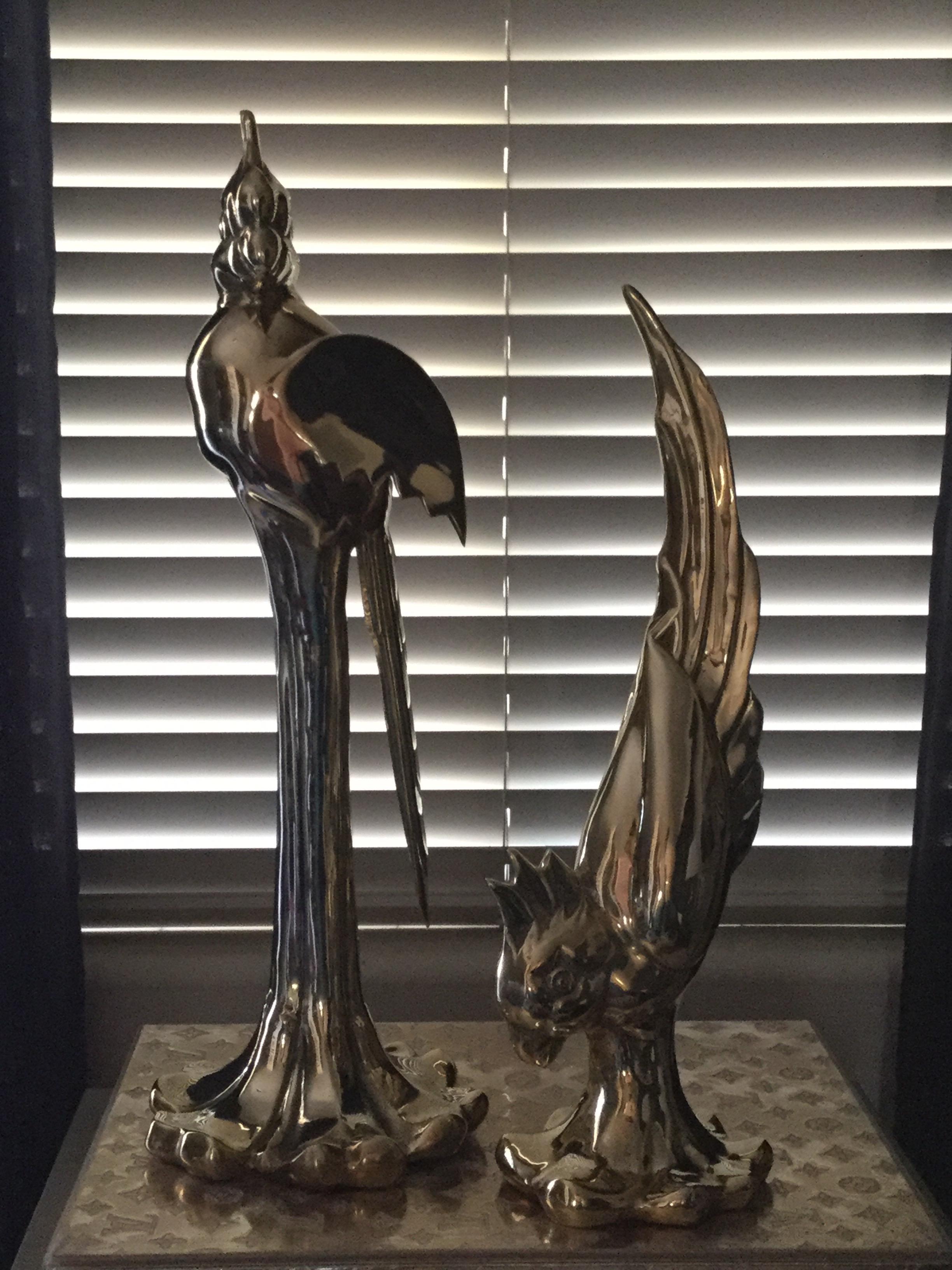 Beautiful pair of large brass parrots by Dolbi. 1980s. Rare and very collectible. Newly polished. Smaller parrot: 18