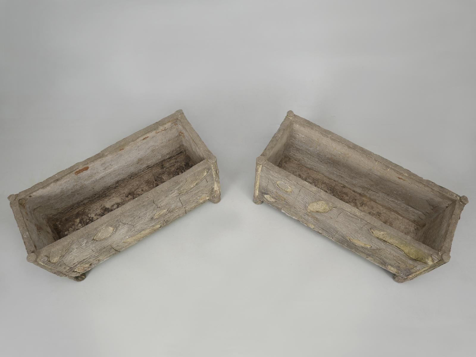 Rare pair of French garden troughs, or planters, in “Faux Bois”, or false wood; the imitation of wood grain and textures. The faux bois technique was created in France and the artisan’s, who created the faux bois, were referred to as, rocailleurs.