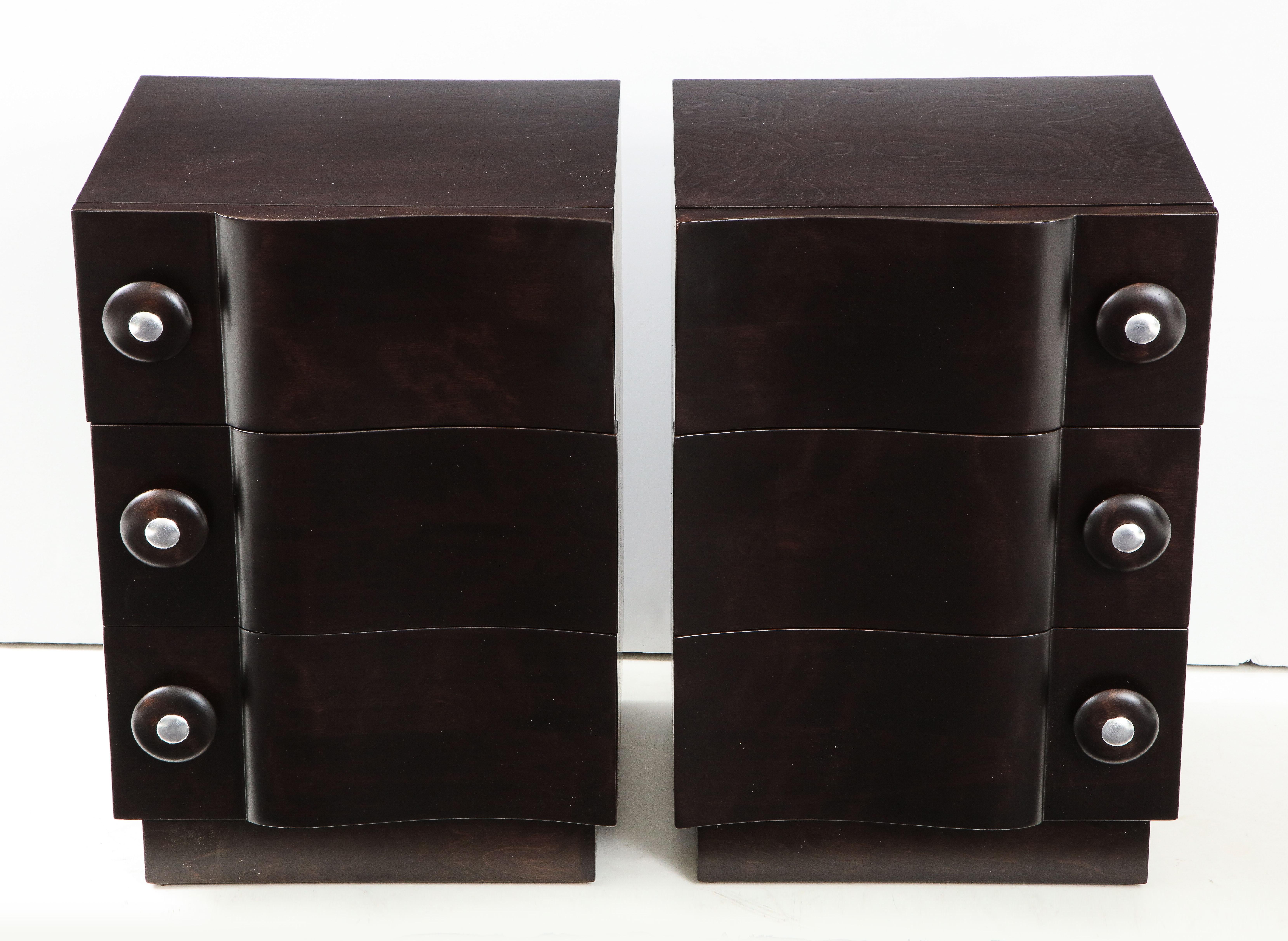 Wonderful pair of rare wave front cabinets / nightstands by James Mont.
The cabinets have been totally restored in a beautiful ebonized finish.
