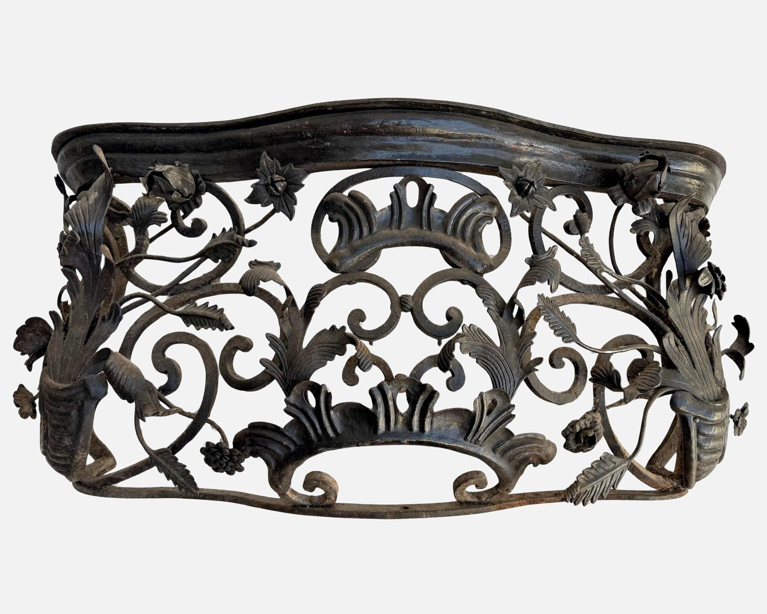 Rare and superb pair of 19th century window railings in the shape of wrought iron baskets decorated with scrolls, flowers, acanthus leaves, shells, etc…, in the style of the 18th century.