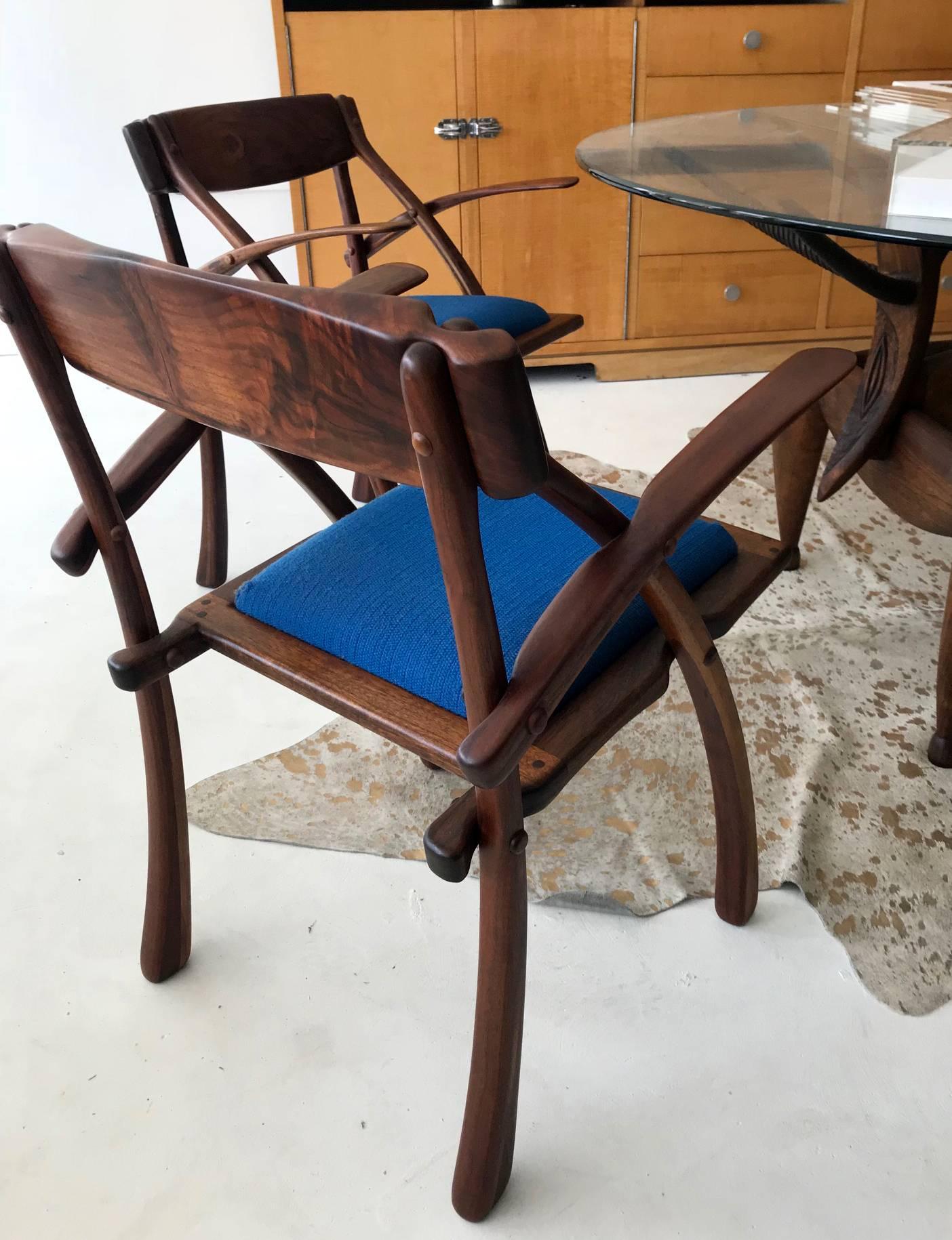 A rare pair of wishbone armchairs studio made by Arthur Espenet Carpenter (1920-2006), Bolinas, CA. In grained walnut with visible dowel construction, a shaped back that continues intoto the contoured arms. Upholstered seats provide comfort and