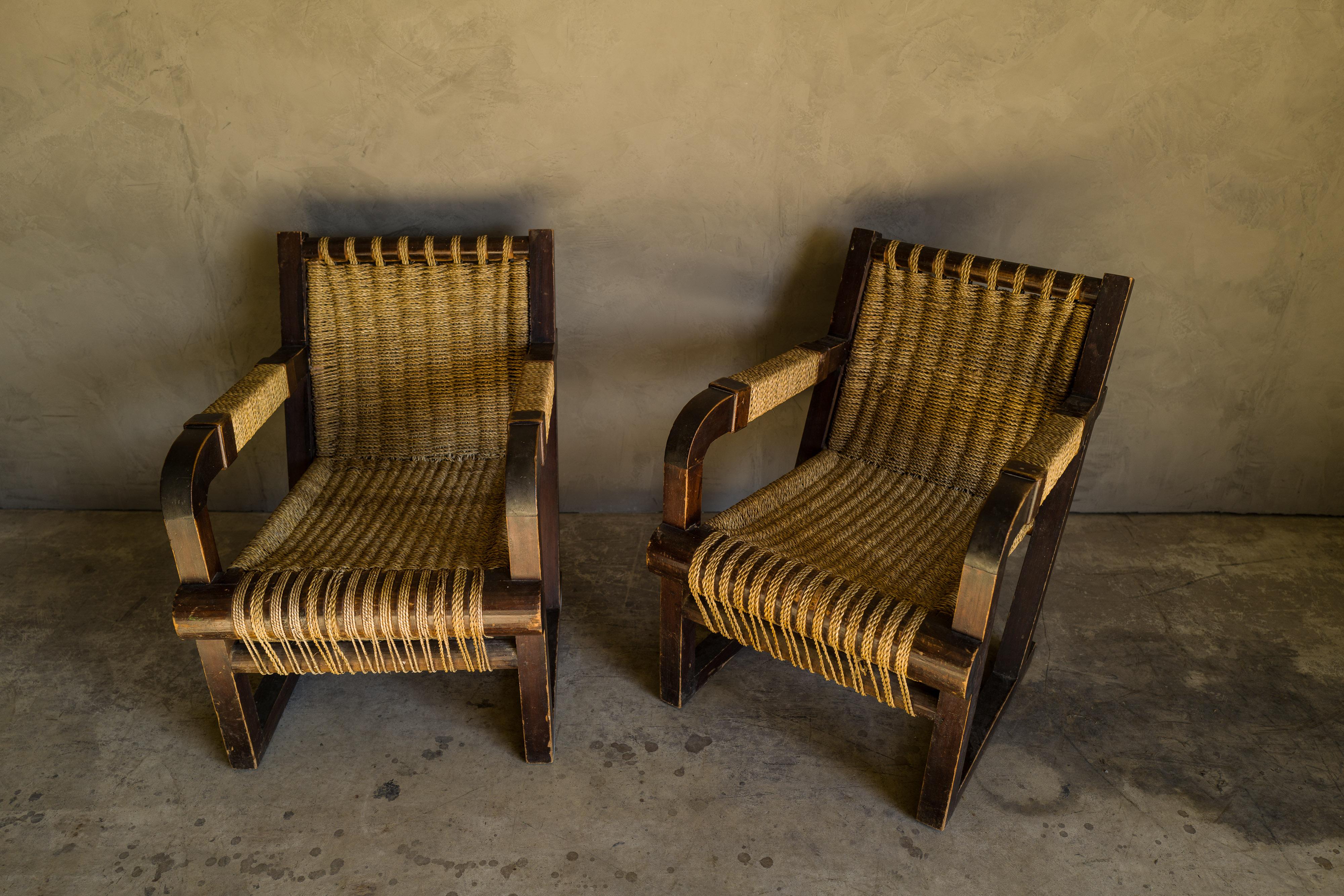 Rare pair of woven lounge chairs from France, circa 1960. Rare model often attributed to Francis Jourdain. Nice wear and patina.